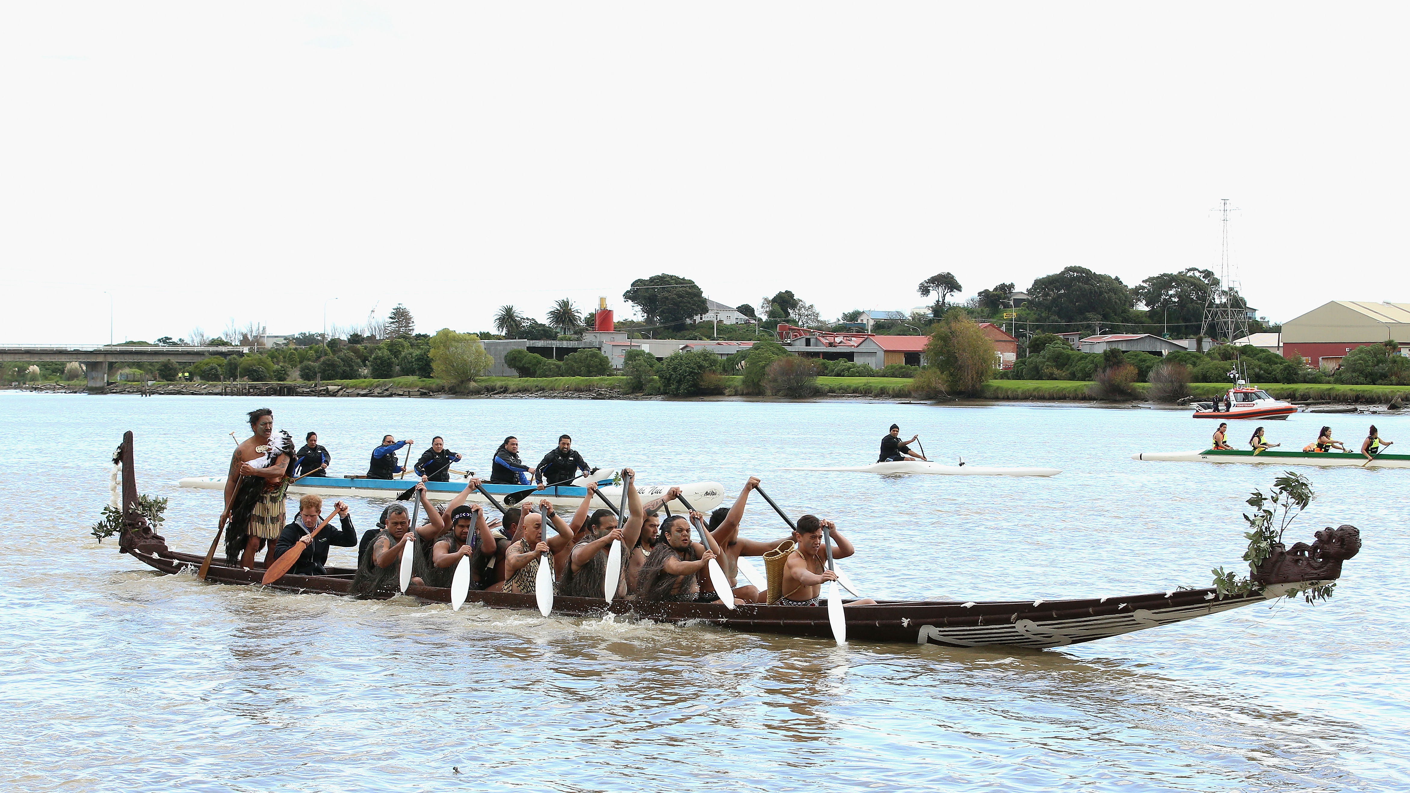 Māori paddlers guide a boat down the Whanganui River in New Zealand, during a visit from Britain's Prince Harry in 2015. (Getty Images)