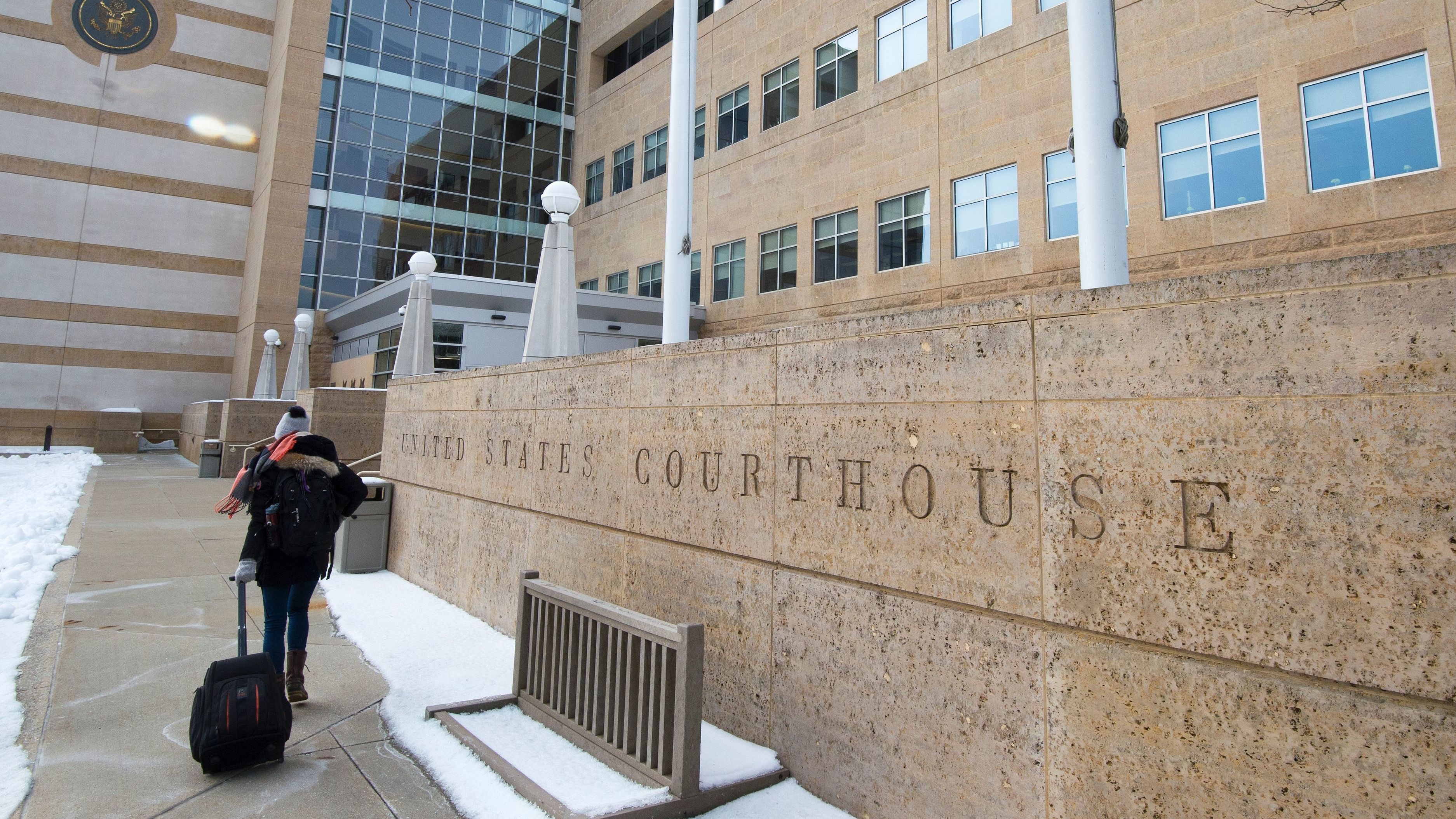 A person enters the U.S. District Court in Greenbelt, Md., on Wednesday. A judge there imposed a preliminary injunction blocking part of President Trump's new travel ban from going into effect. (AFP/Getty Images)