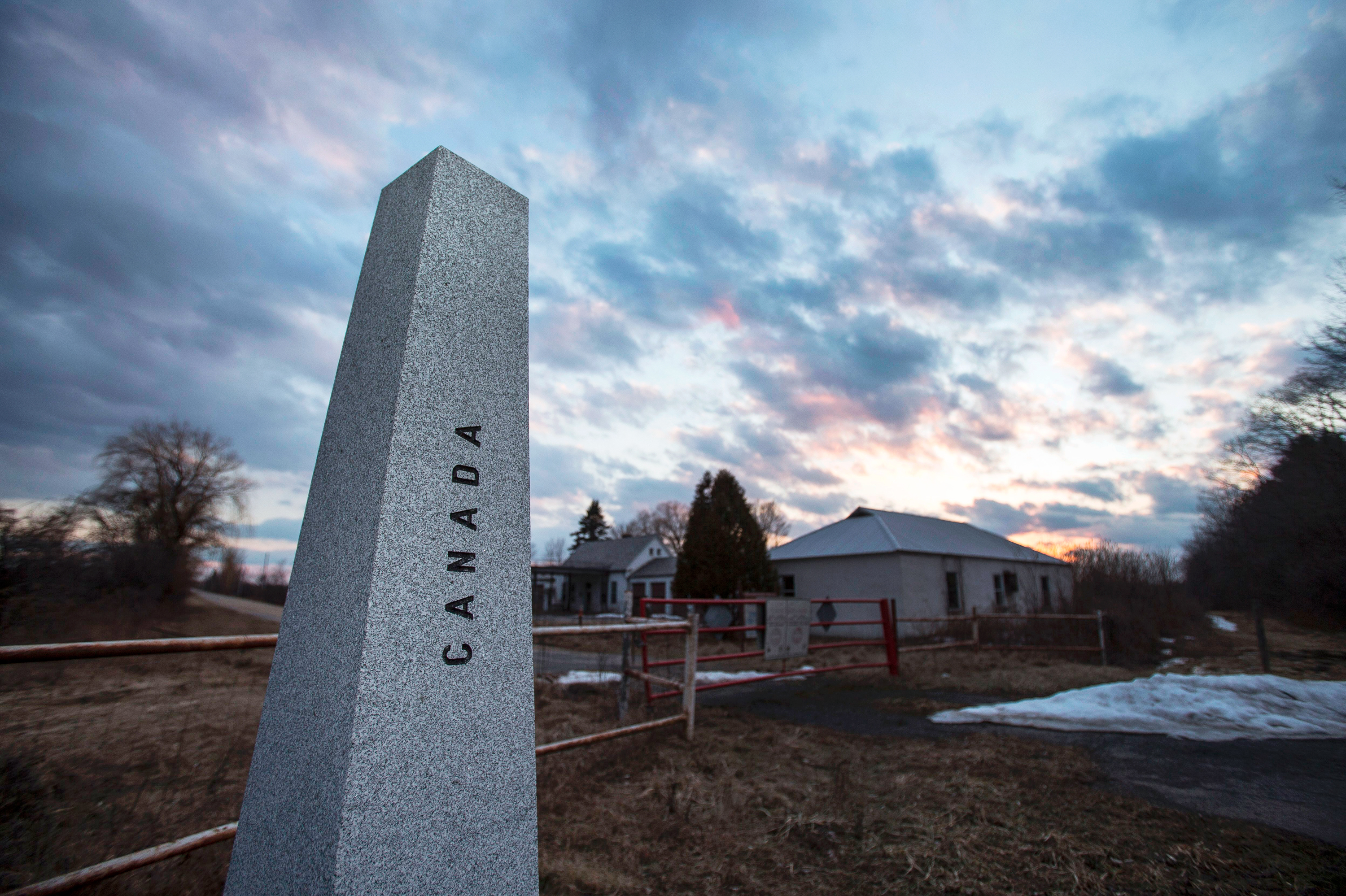 The sun sets behind an abandoned customs station on the US side of the Canada/U.S. border on Meridian Road in Champlain, N.Y., in Feb. 2017. (AFP/Getty Images)