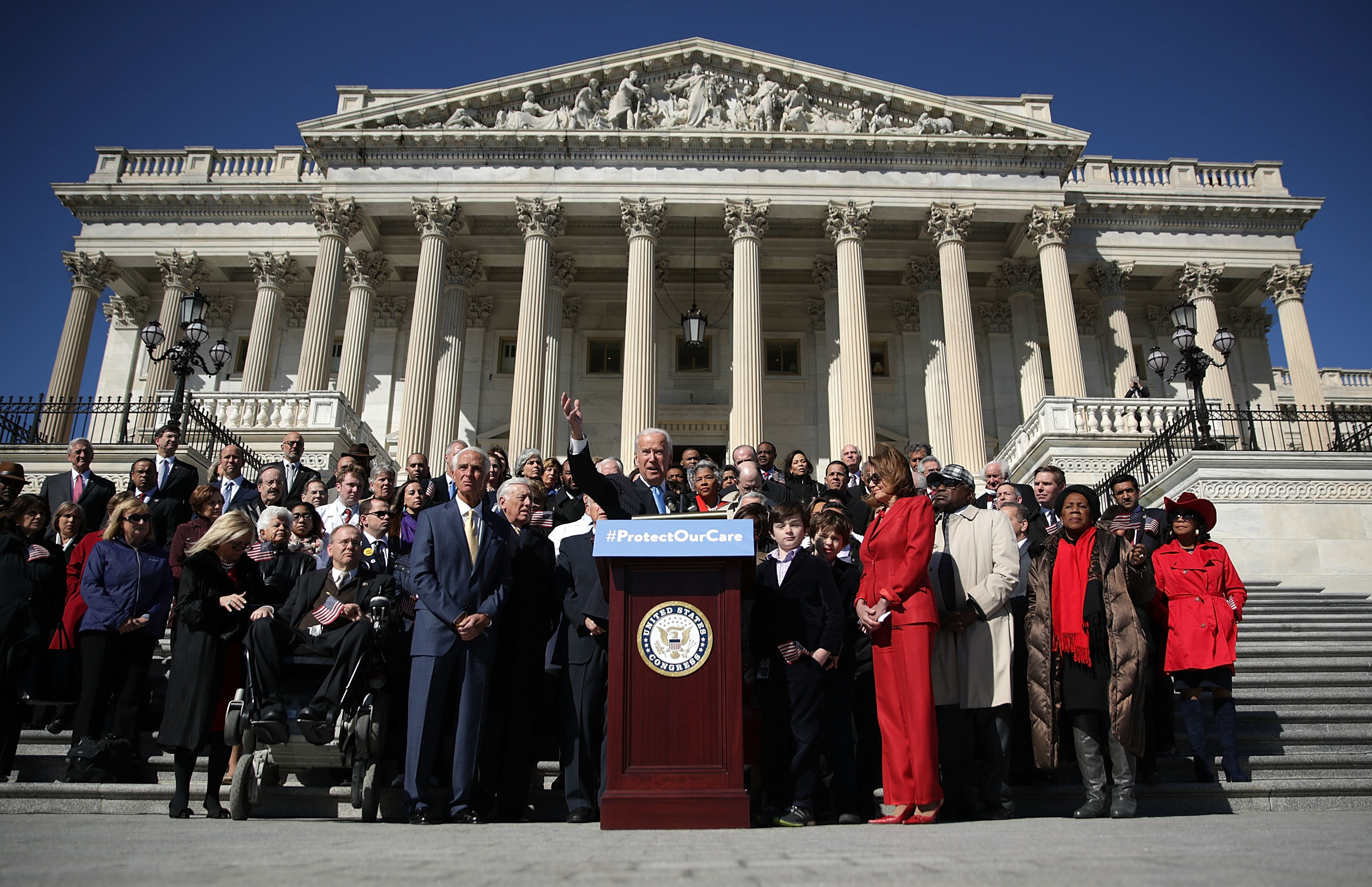 Former Vice President Joe Biden (center) speaks during an event held by Democrats on Wednesday to mark the seventh anniversary of the Affordable Care Act. (Getty Images)