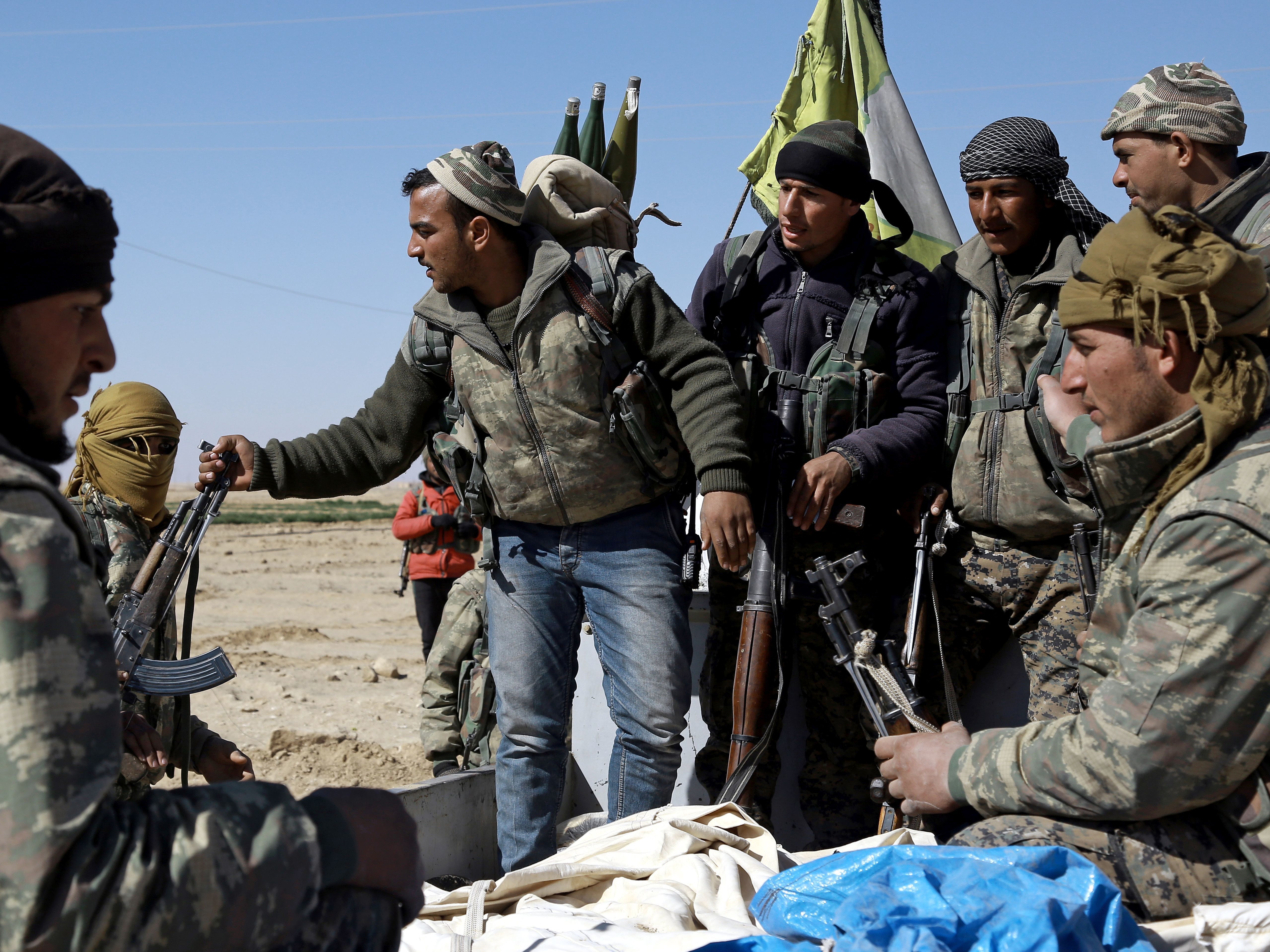U.S.-backed Syrian Democratic Forces, made up of an alliance of Arab and Kurdish fighters, regroup on the northern outskirts of Deir Ezzor as they advance to encircle the ISIS bastion of Raqqa on Feb. 21. (AFP/Getty Images)