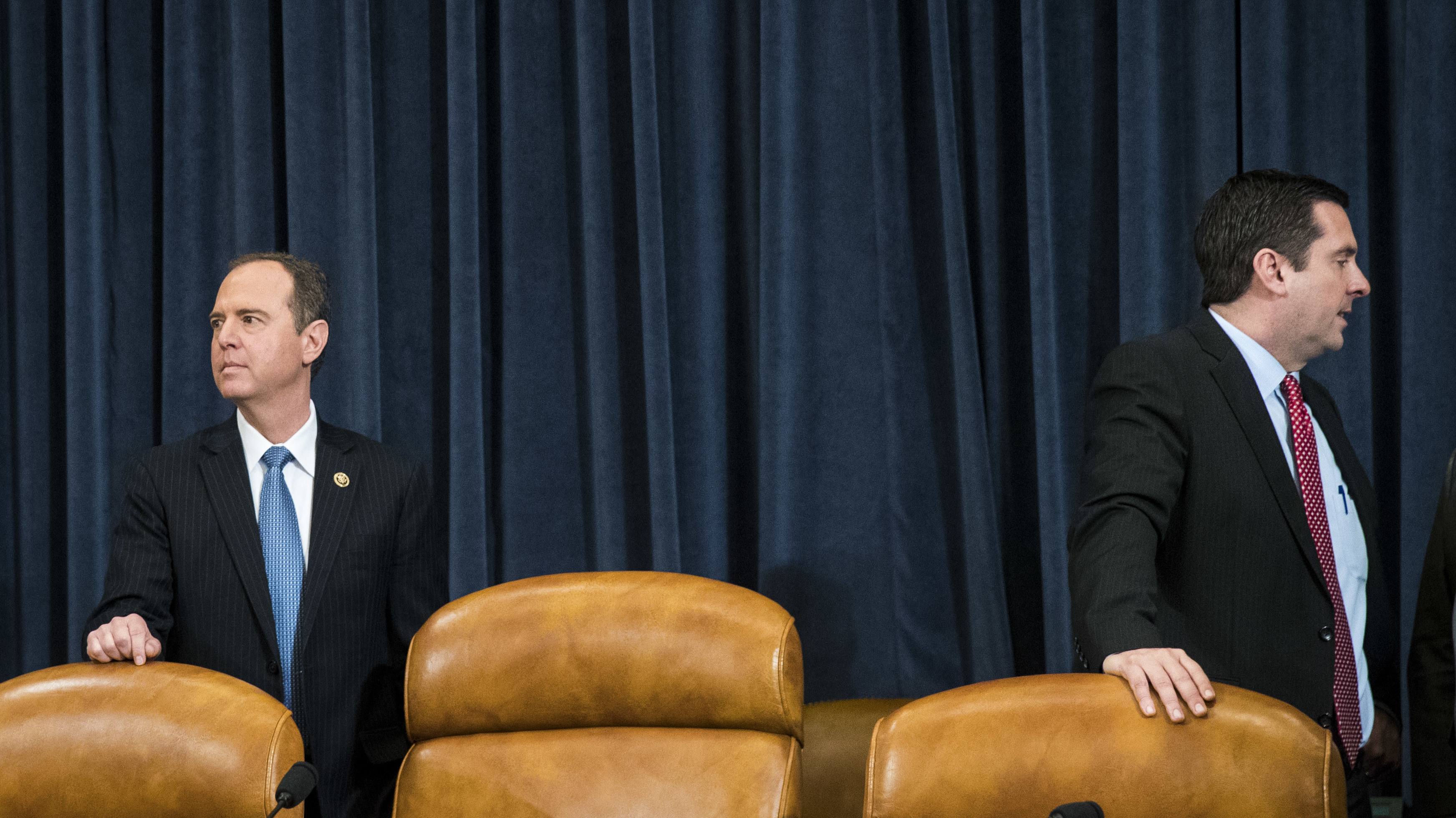 Ranking committee member Adam Schiff, D-Calif. (left), and Chairman Devin Nunes, R-Calif., prepare to take their seats on Monday at a House Permanent Select Committee on Intelligence hearing concerning Russian meddling in the 2016 U.S. election. (Getty Images)