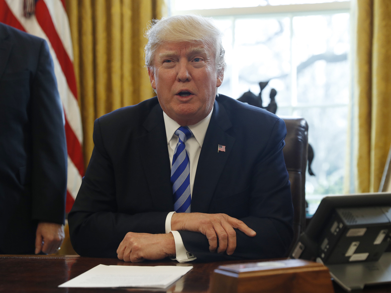 President Trump speaks to the media in the Oval Office on Friday. (Pablo Martinez Monsivais/AP)