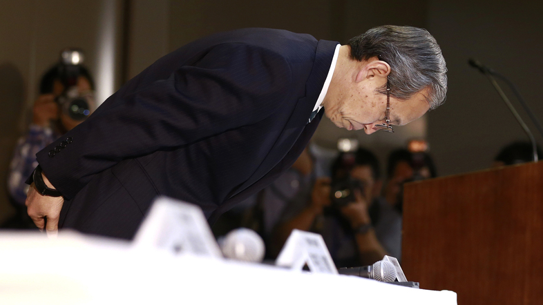 Toshiba Corp. President Satoshi Tsunakawa bows during a press conference at the company's headquarters in Tokyo on Wednesday. Toshiba says its American nuclear unit Westinghouse Electric has filed for bankruptcy protection. (Shizuo Kambayashi/AP)