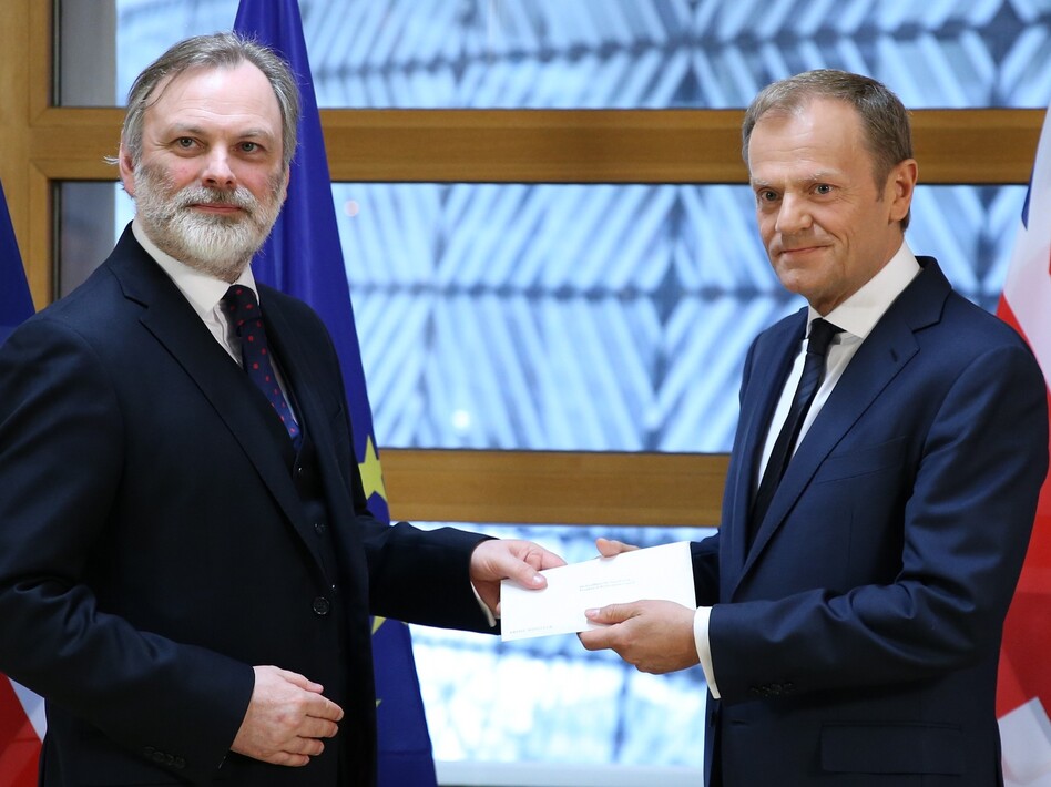 British Ambassador to the EU Tim Barrow (left) delivers Prime Minister Theresa May's formal notice of the U.K.'s intention to leave the bloc to European Council President Donald Tusk in Brussels on Wednesday. (Anadolu Agency/Getty Images)