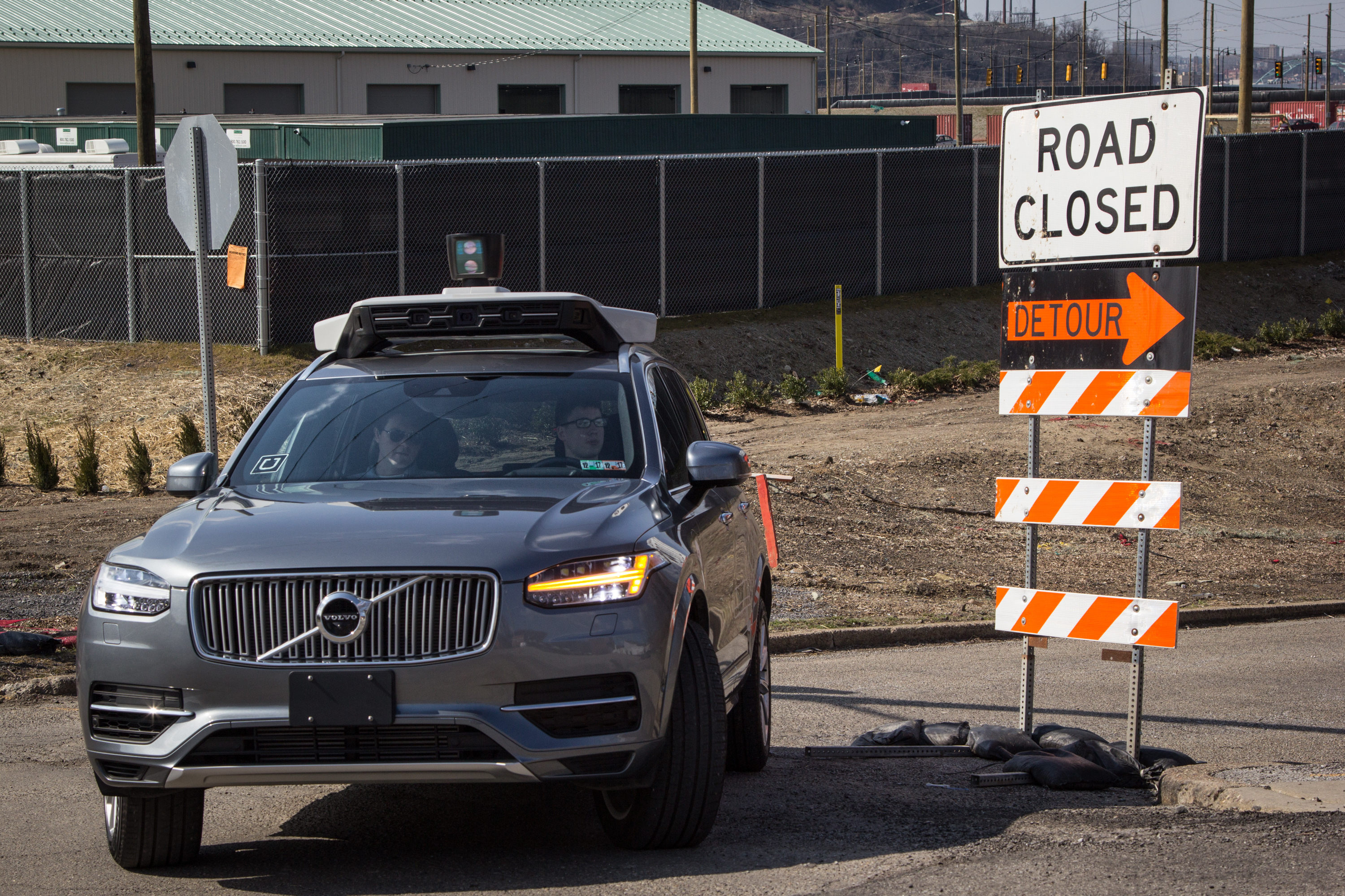 Each autonomous vehicle has two Uber exployees in the front seat; one is ready to grab the wheel and apply a foot to the brake pedal, the other in the passenger seat, has a computer screen showing what the car's rooftop laser-bouncing radar is seeing. (NPR)
