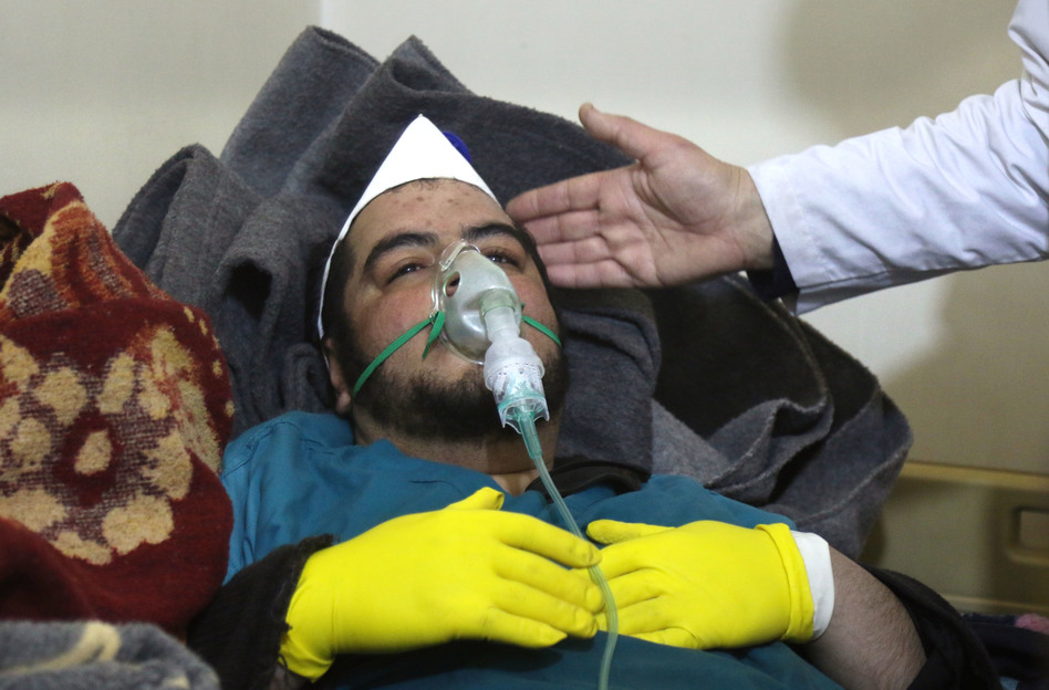 A Syrian man receives treatment following a suspected toxic chemical attack Tuesday in Khan Shaykhun, a rebel-held town in Syria's northwestern Idlib province. At least 72 people were killed, including a number of children. (Mohamed al-Bakour/AFP/Getty Images)
