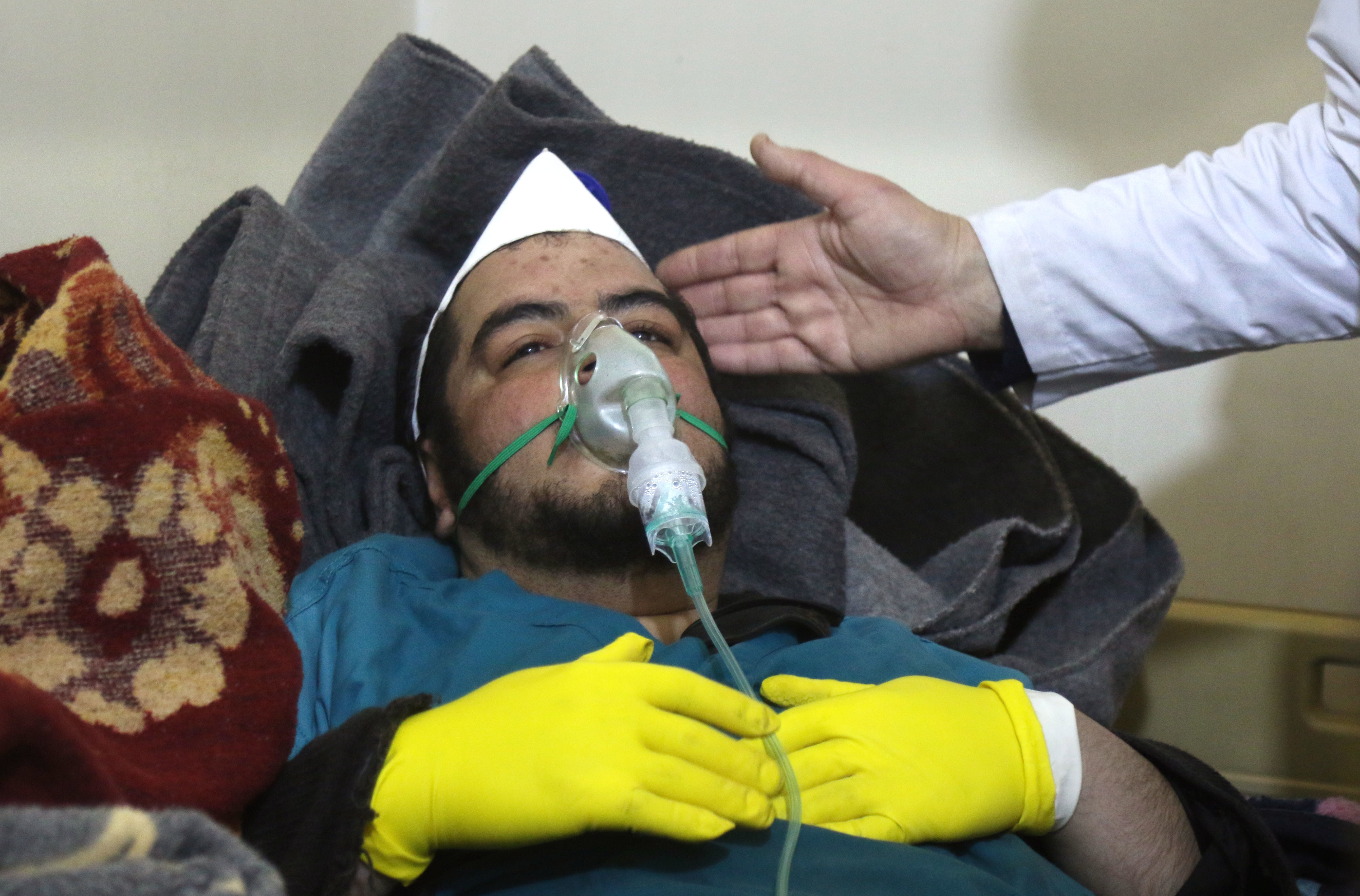 A Syrian man receives treatment following a suspected toxic chemical attack Tuesday in Khan Shaykhun, a rebel-held town in Syria's northwestern Idlib province. At least 72 people were killed, including a number of children. (AFP/Getty Images)