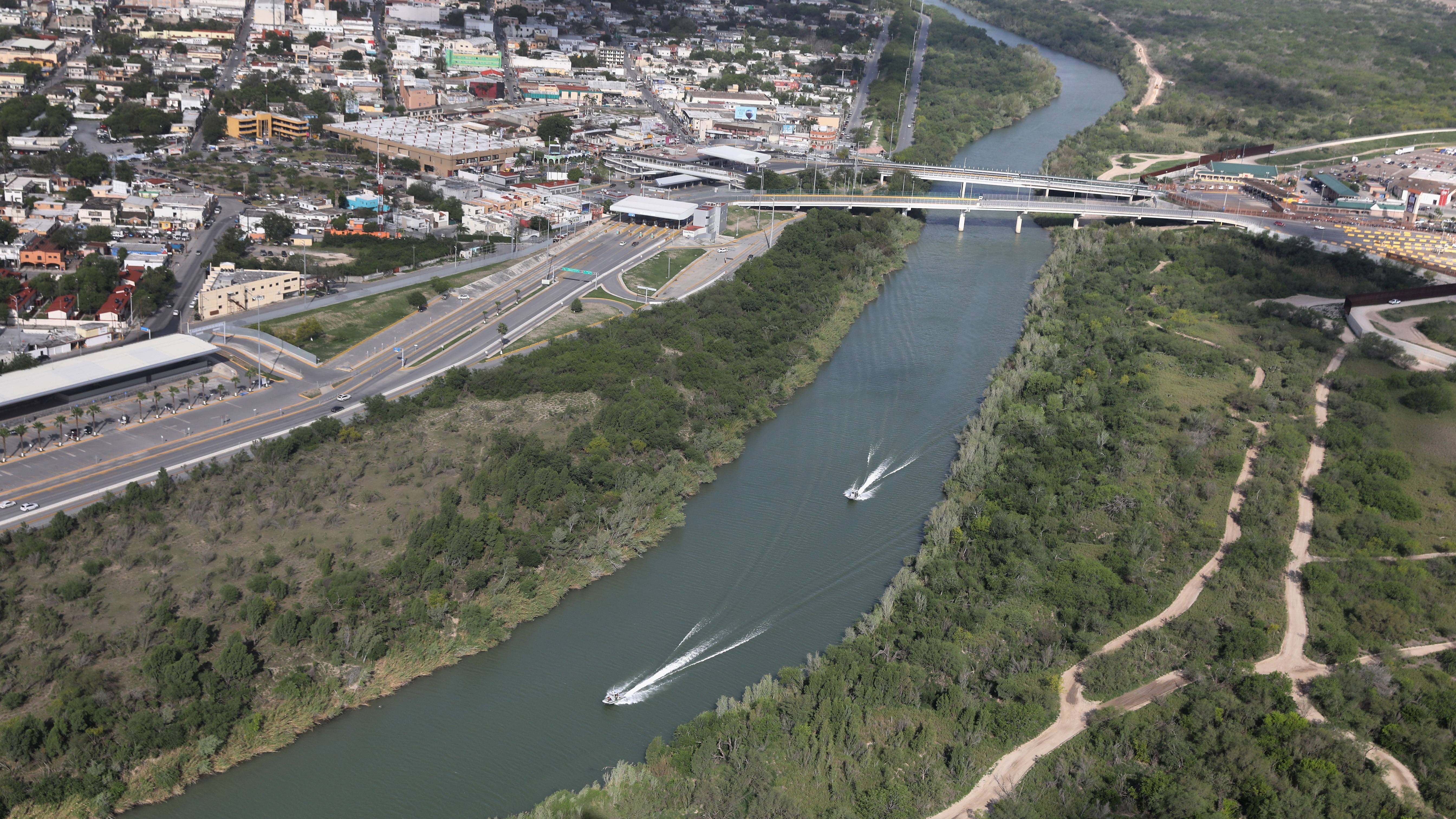 U.S. Border Patrol boats move along the Rio Grande near an international crossing between the United States and Mexico on March 16. Customs and Border Protection have announced that apprehensions along the southwest border dropped in both February and March, when they usually rise. (Getty Images)
