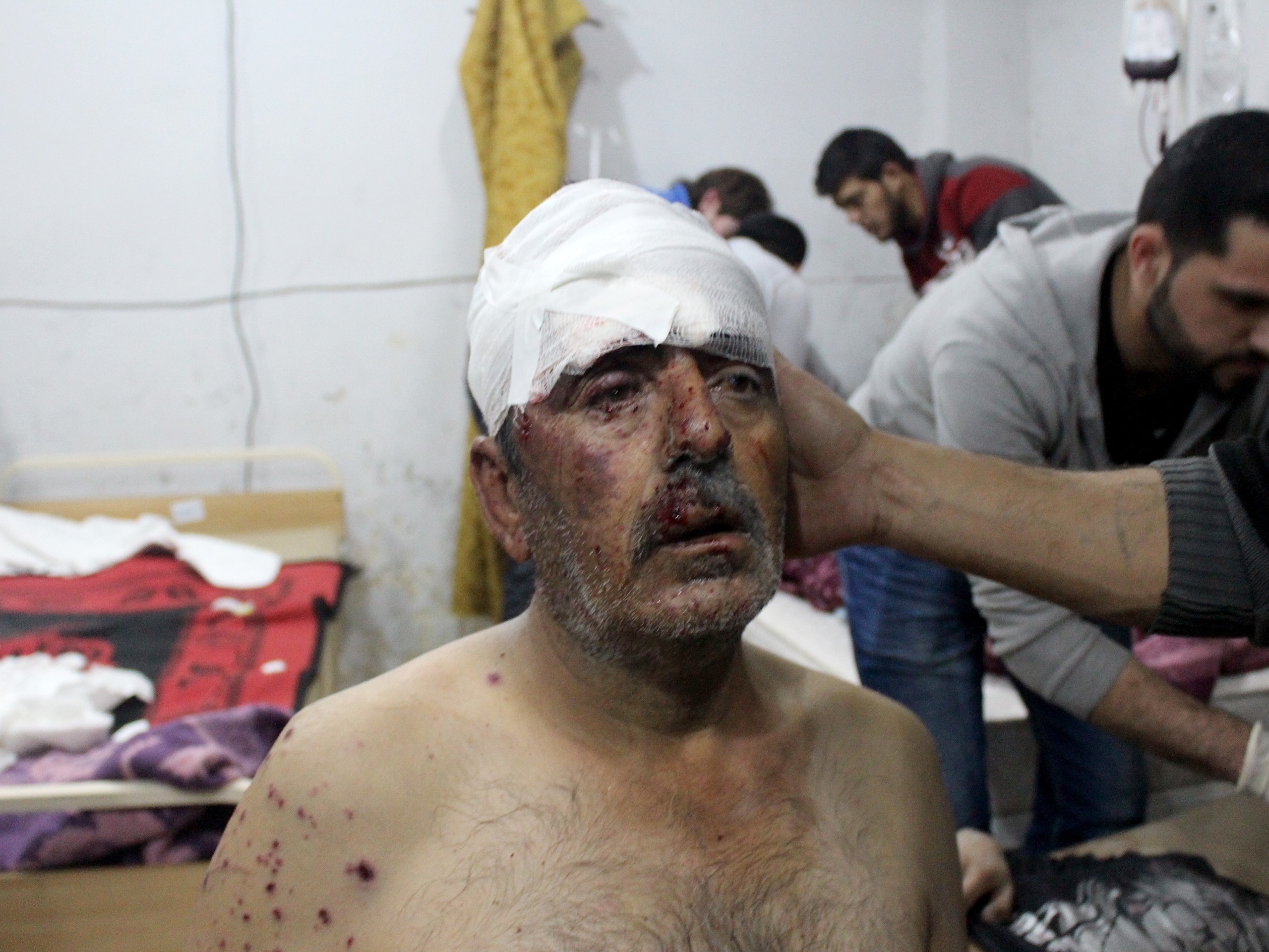 A wounded man receives treatment following airstrikes in Idlib province. (Abdulghani Arian/Anadolu Agency/Getty Images)