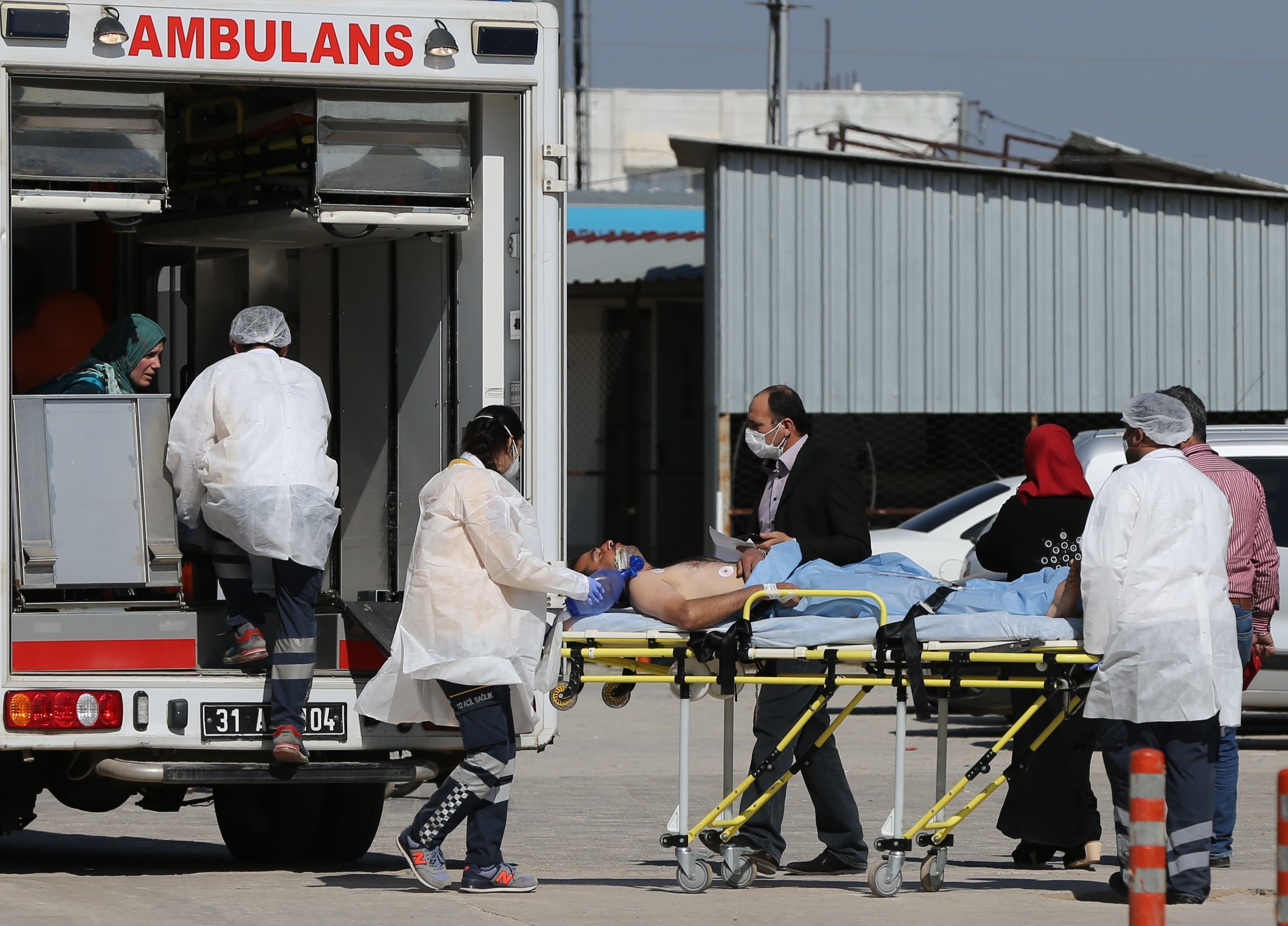 An injured Syrian man is taken to Reyhanli State Hospital in Hatay, Turkey, on Tuesday. A suspected chemical attack took place in Idlib, Syria. (Getty Images)