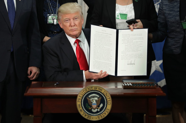 President Trump signs the first travel ban. The second ban has been stayed, for now, but some say it's still affecting American higher education.