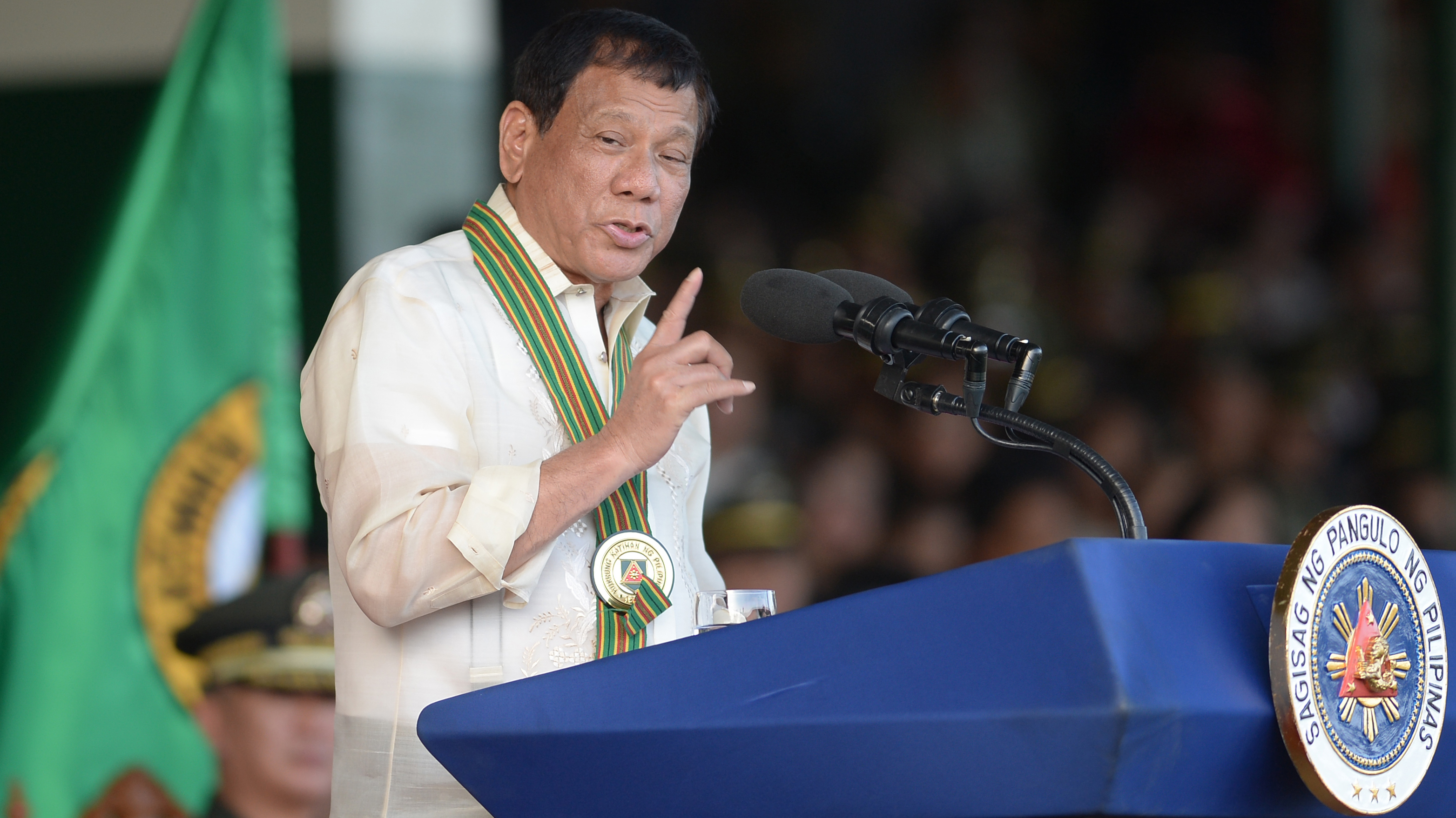 Philippine President Rodrigo Duterte, seen here at an army camp this week, says his country should occupy islands it claims in the South China Sea.