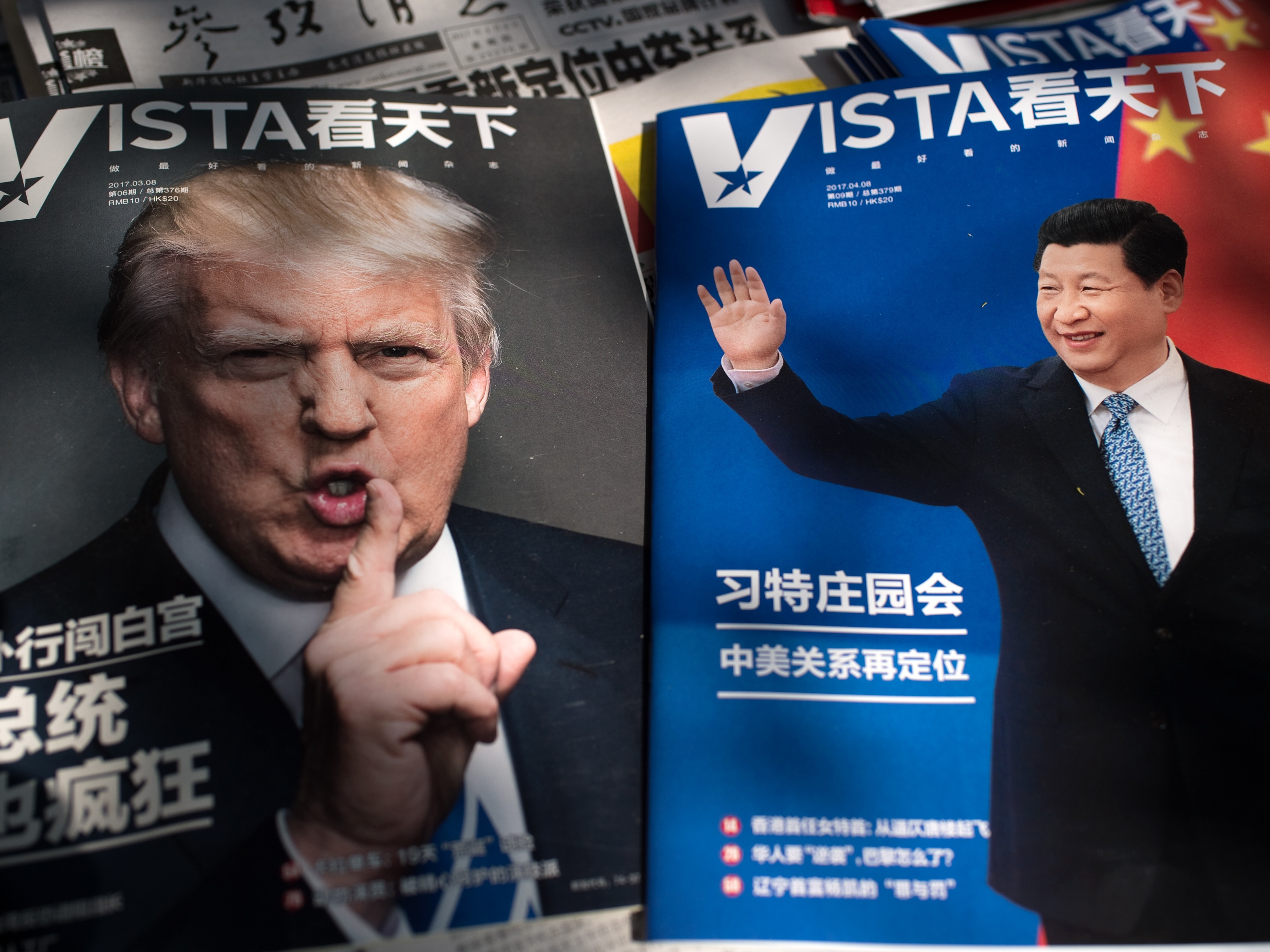 Magazines at a Beijing newsstand show images of President Trump and Chinese President Xi Jinping. The two leaders are meeting at Mar-a-Lago Thursday and Friday. (AFP/Getty Images)