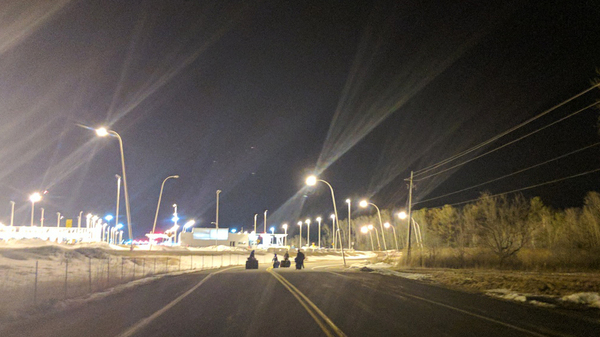 Amal and her three sons walk toward the Canadian border.