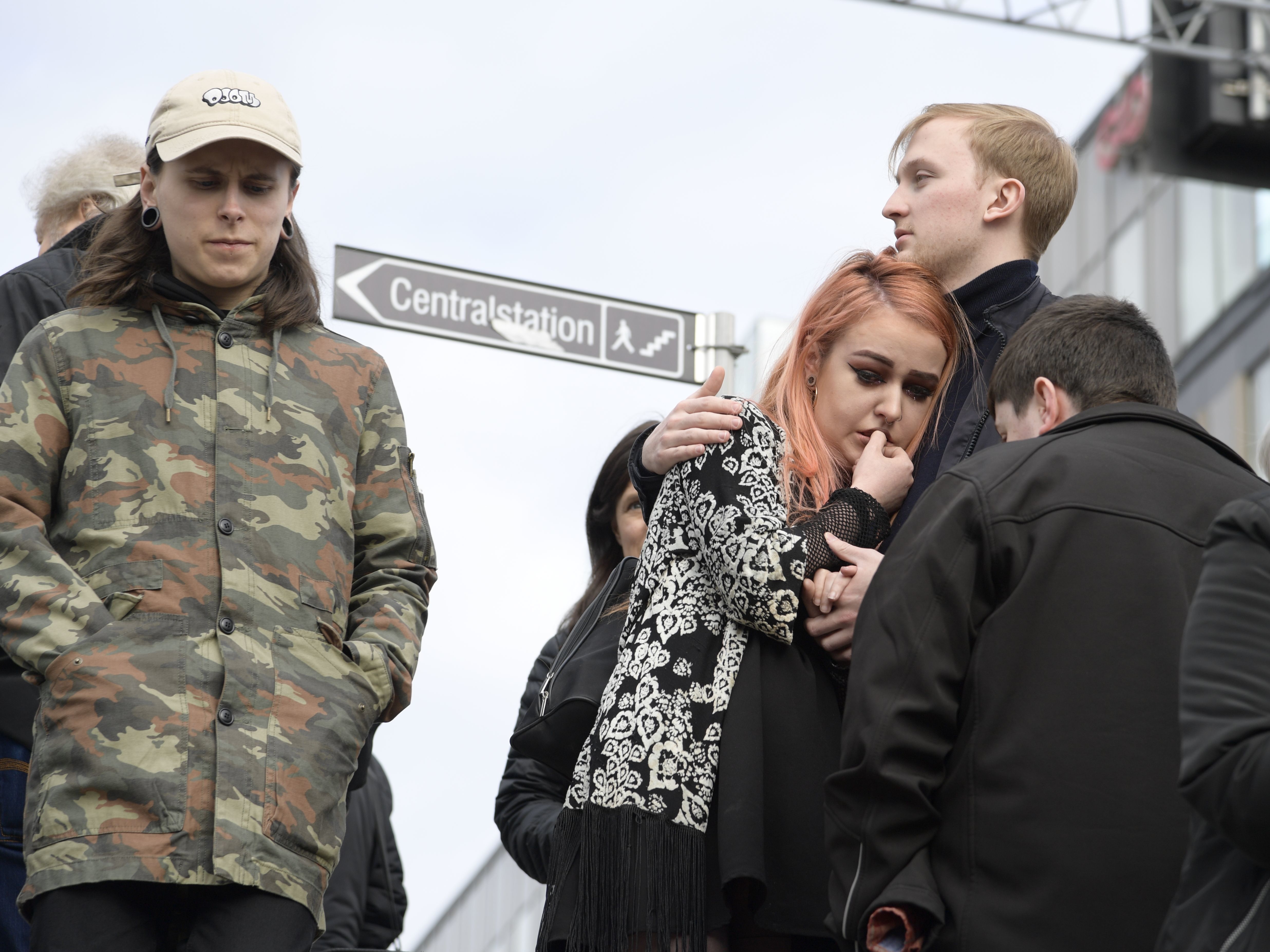 People react near where a truck crashed into the Ahlens department store in central Stockholm on Friday.
(Andreas Schyman/AFP/Getty Images)