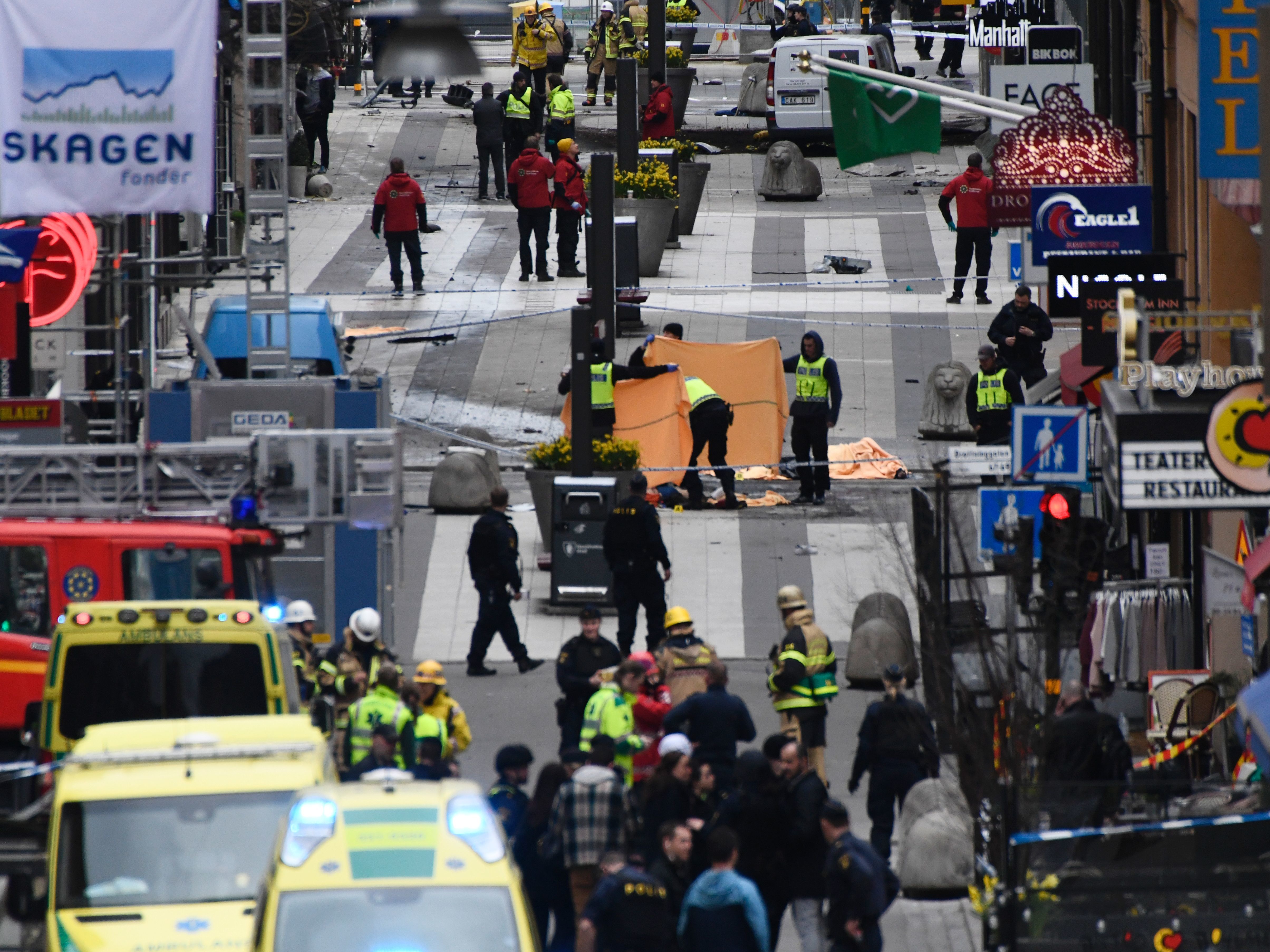 Emergency crews work at the scene where a truck crashed into the Ahlens department store in central Stockholm on Friday.
(Jonathan Nackstrand/AFP/Getty Images)