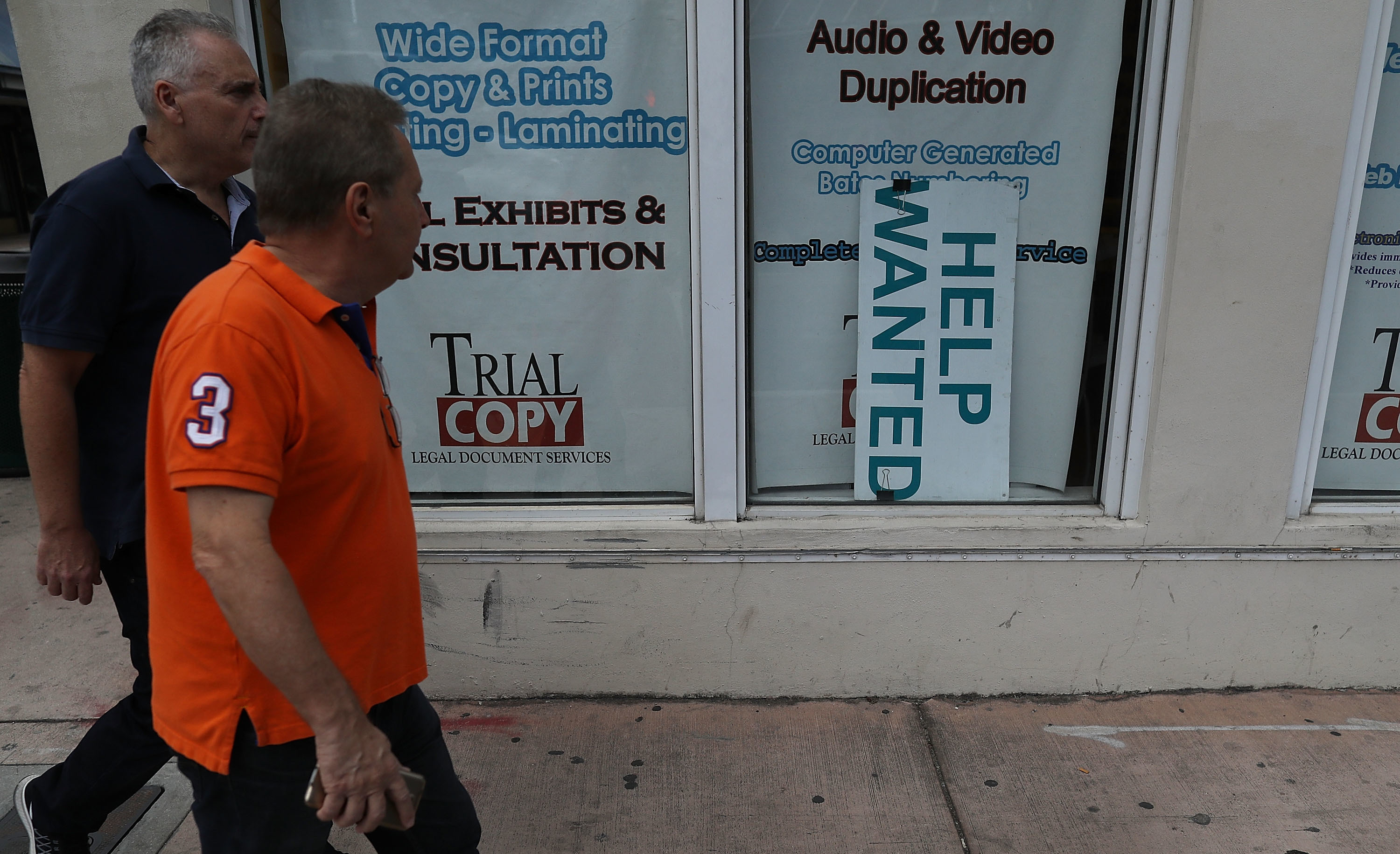A &quot;help wanted&quot; sign hangs in a storefront window in Miami last month. The Bureau of Labor Statistics says nonfarm payrolls increased by 98,000 in March, far below analysts' expectations. (Getty Images)