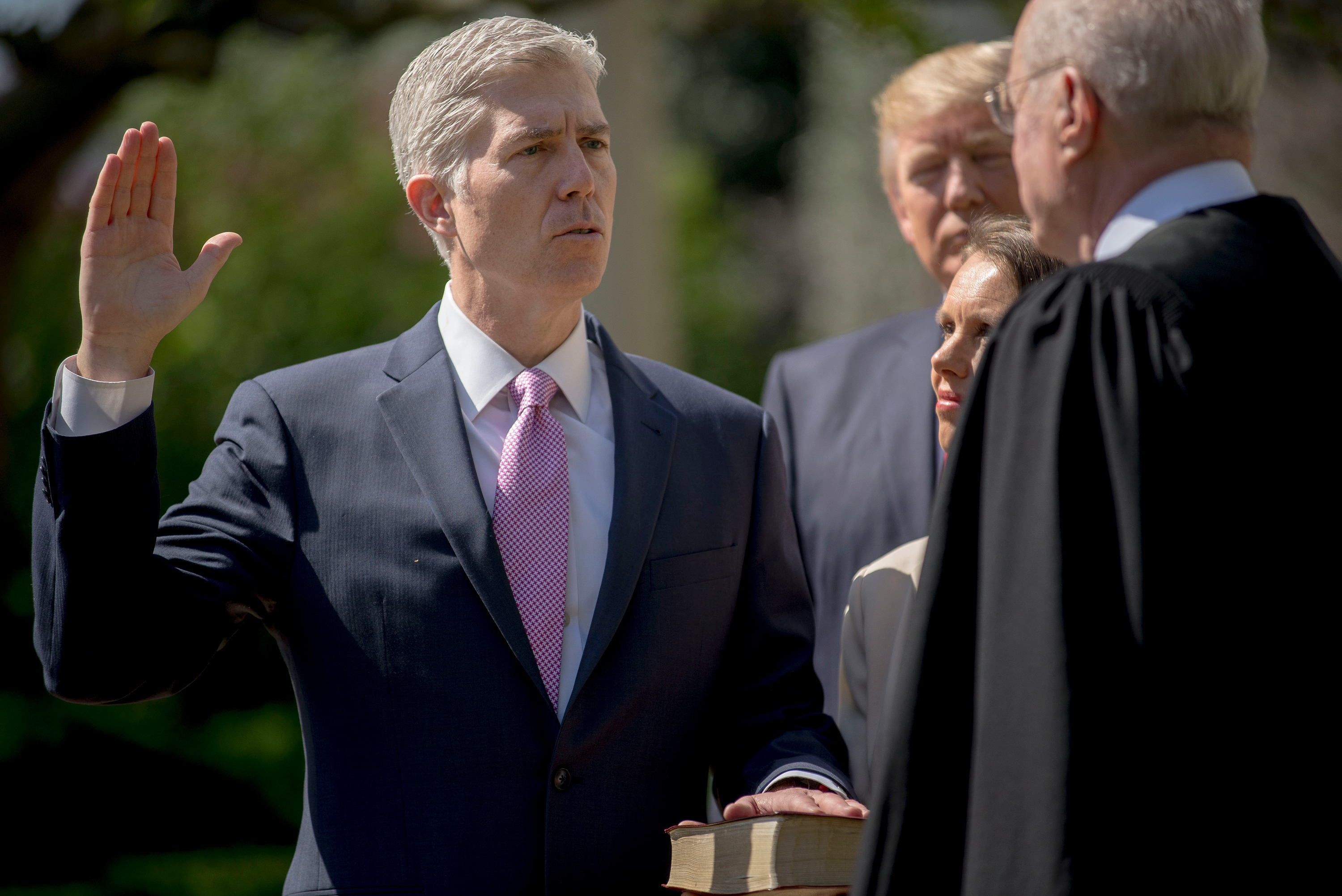 Justice Anthony Kennedy administers the judicial oath for Judge Neil M. Gorsuch during a public swearing-in ceremony at the White House on Monday. (Gabriella Demczuk for NPR)