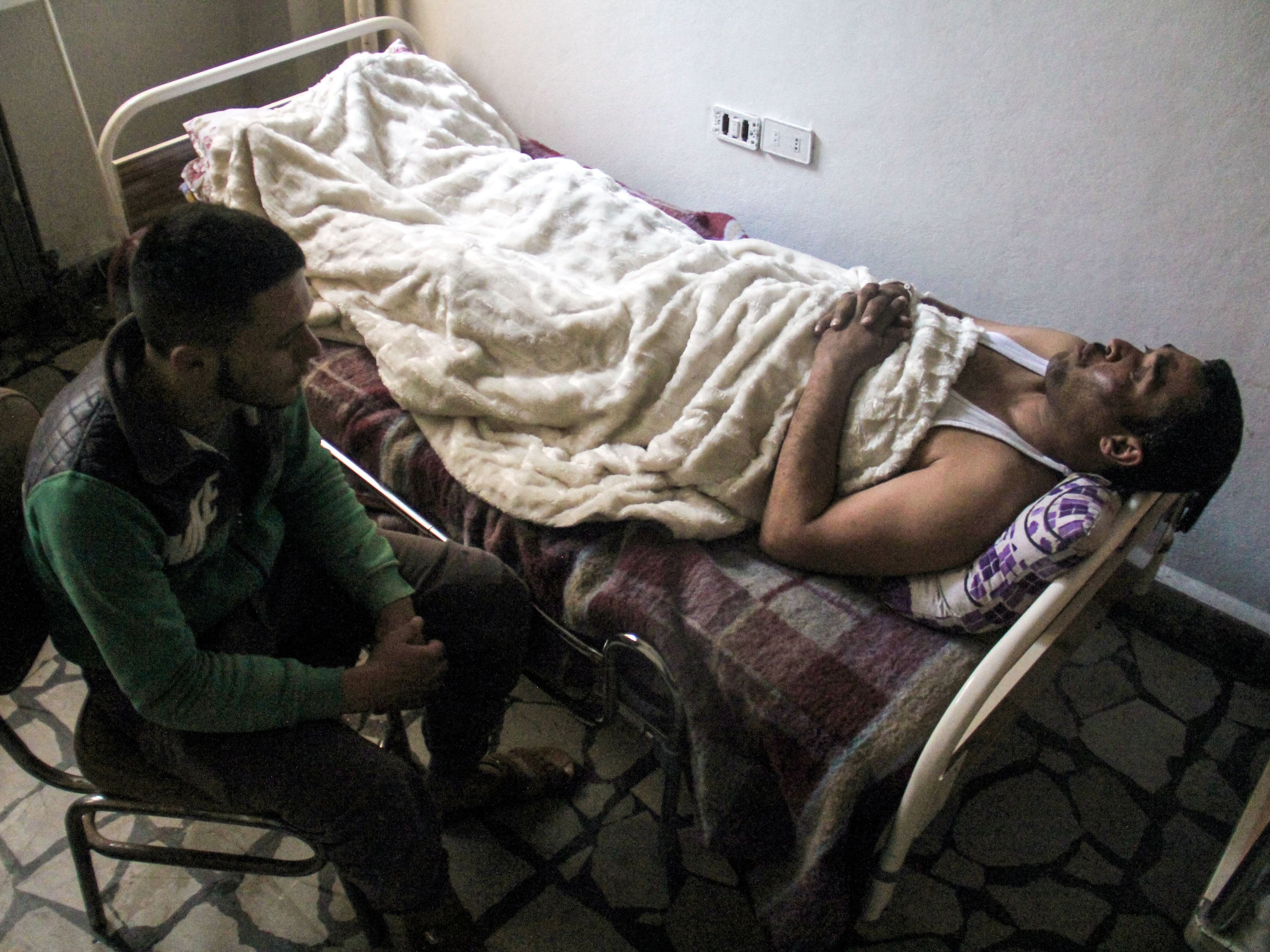 Hassan Youssef, a 40-year-old victim of the April 4 chemical attack in Khan Shaykun, receives medical care in a hospital in the nearby Syrian city of Idlib on Thursday.
(Omar Haj Kadour/AFP/Getty Images)