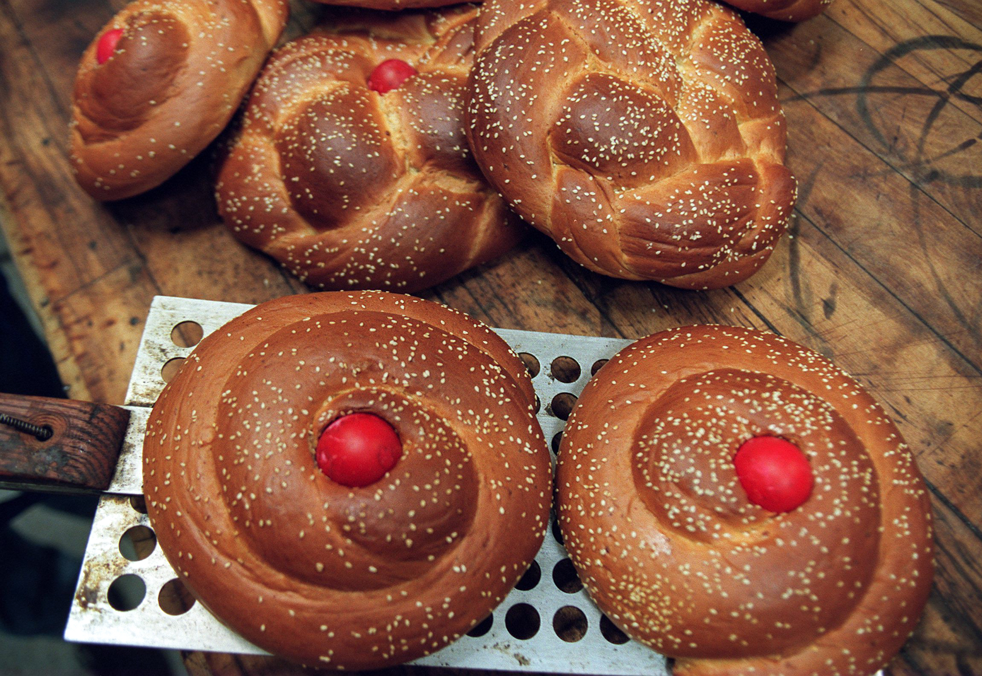 Eggs dyed blood red at the center of the Greek Easter treat known as tsoureki paschalino. (Jonathan Wiggs/Boston Globe via Getty Images)