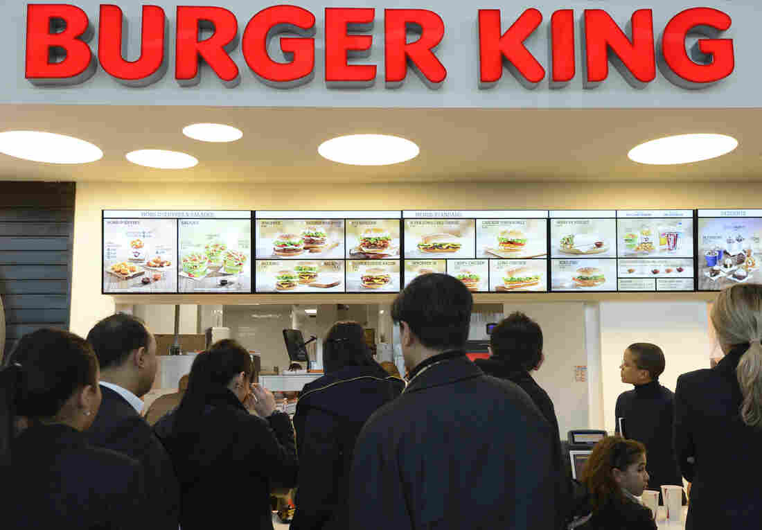 Customers await their orders at a Burger King in in Marignane, France, in 2012.