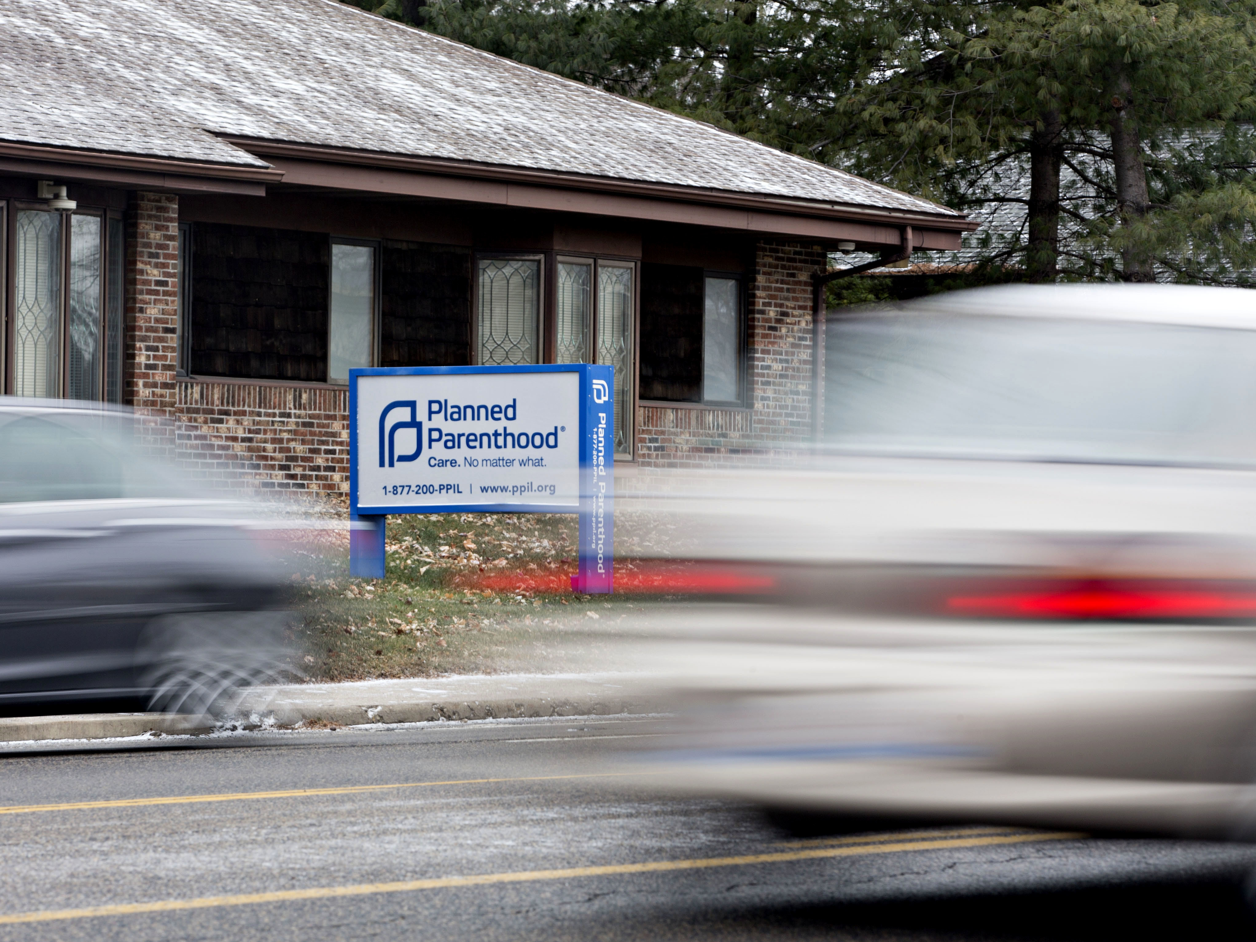 Vehicles drive past a Planned Parenthood office in Peoria, Ill., in December 2016. (Bloomberg via Getty Images)