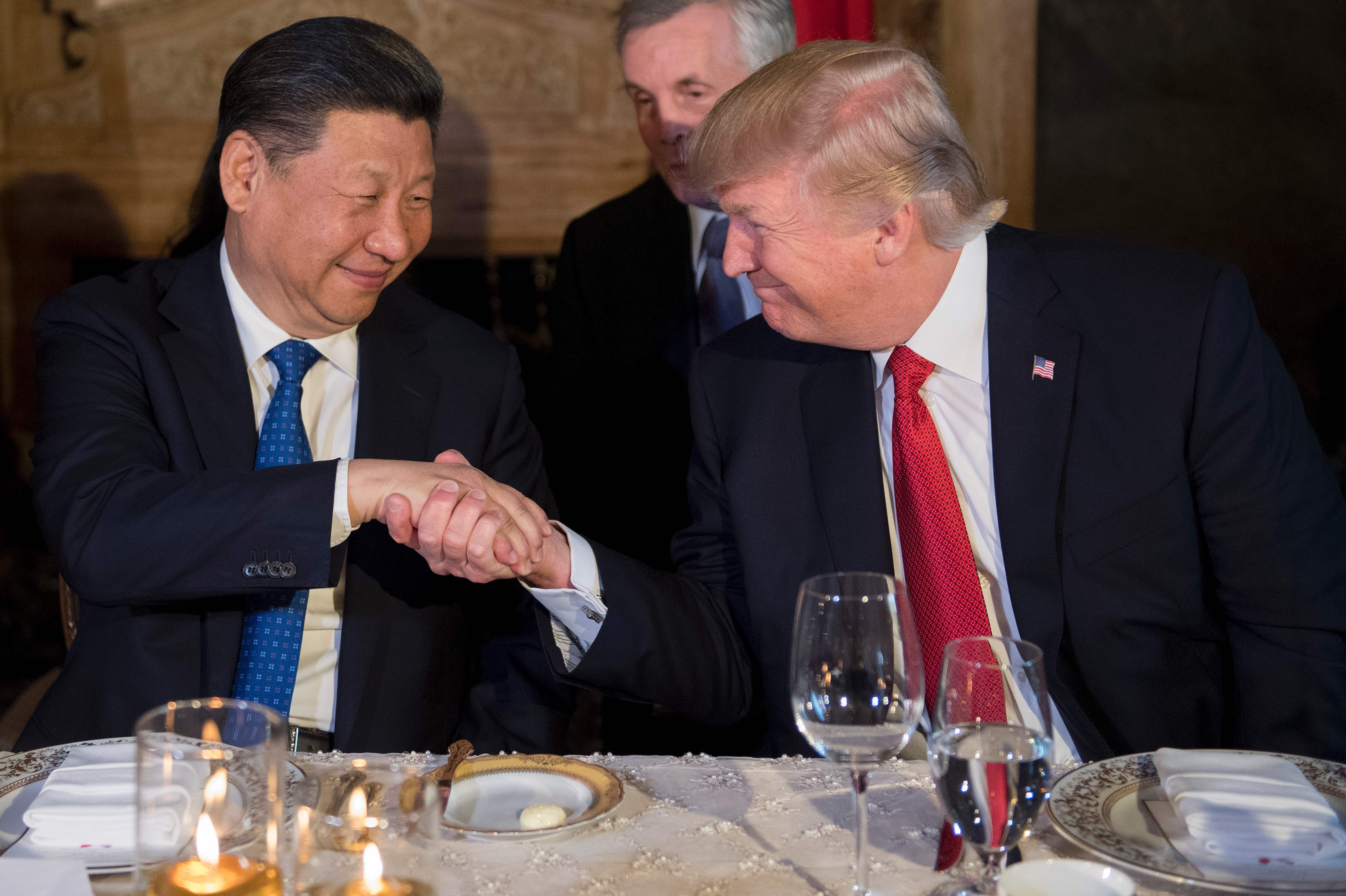 Chinese President Xi Jinping and President Trump shake hands during dinner at Trump's Mar-a-Lago estate in Palm Beach, Fla., on April 6, during the first face-to-face meeting of the two leaders. (AFP/Getty Images)