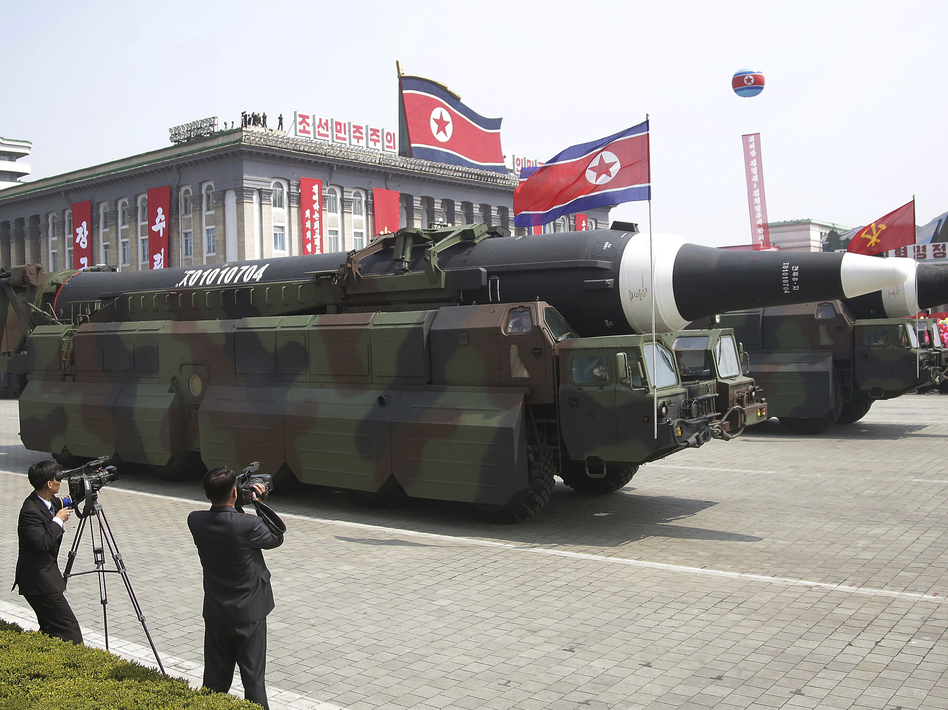 During a Saturday parade commemorating its founder's birthday, North Korea rolled out what appeared to be new intercontinental ballistic missiles. The country has been warned against having such weapons. (Wong Maye-E/AP)