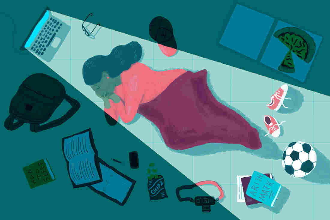 College student sleeping on dorm room floor