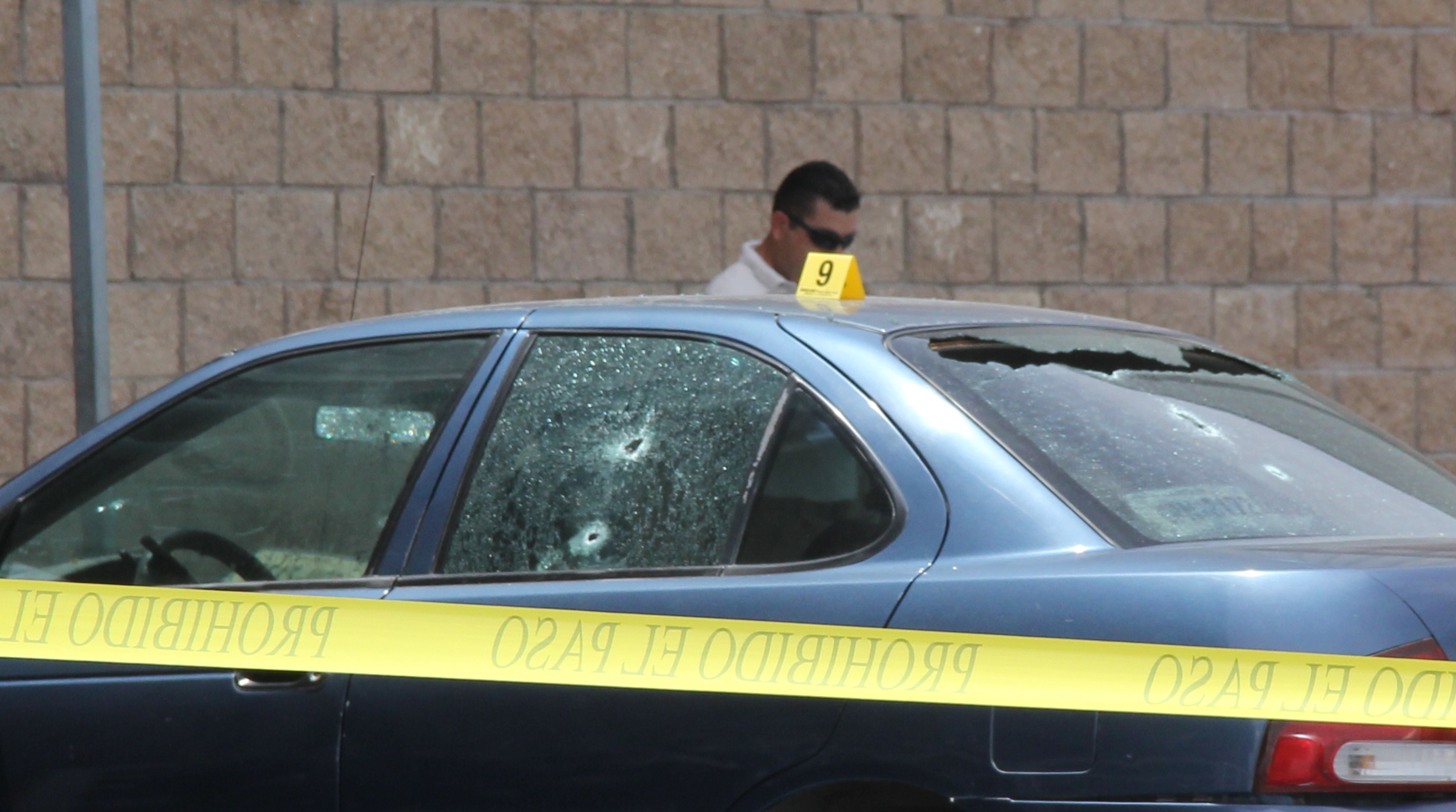 Police investigators work on the crime scene where Mexican journalist Maximino Rodriguez Palacios was killed by gunmen April 14 in La Paz, Baja California Sur, Mexico. (AFP/Getty Images)