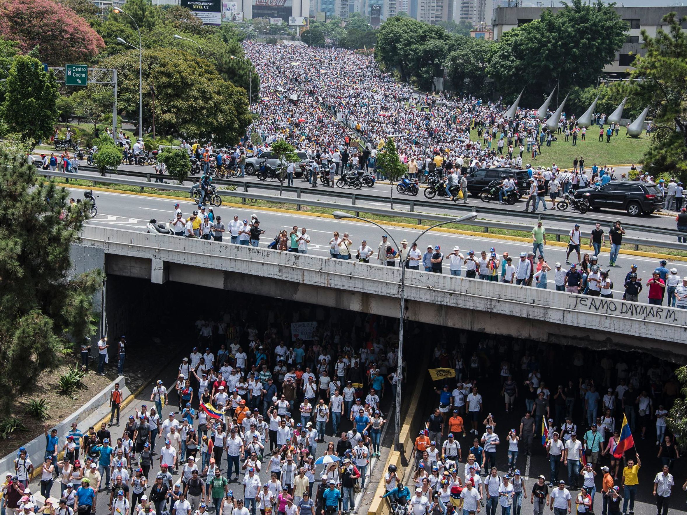 Demonstrators clog a Caracas highway on Wednesday, shouting their resistance to President Nicolas Maduro. The president's push to tighten his power has helped trigger deadly unrest in Venezuela. (Carlos Becerra/AFP/Getty Images
)