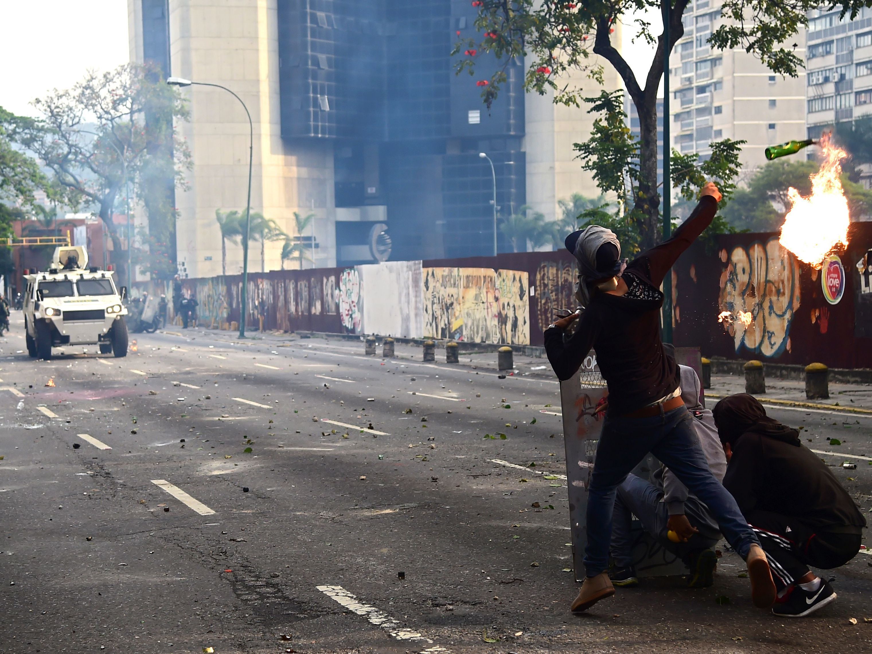 Demonstrators hurl flaming objects at riot police during a rally in Caracas against Venezuelan President Nicolas Maduro on Wednesday.
(Ronaldo Schemidt/AFP/Getty Images)