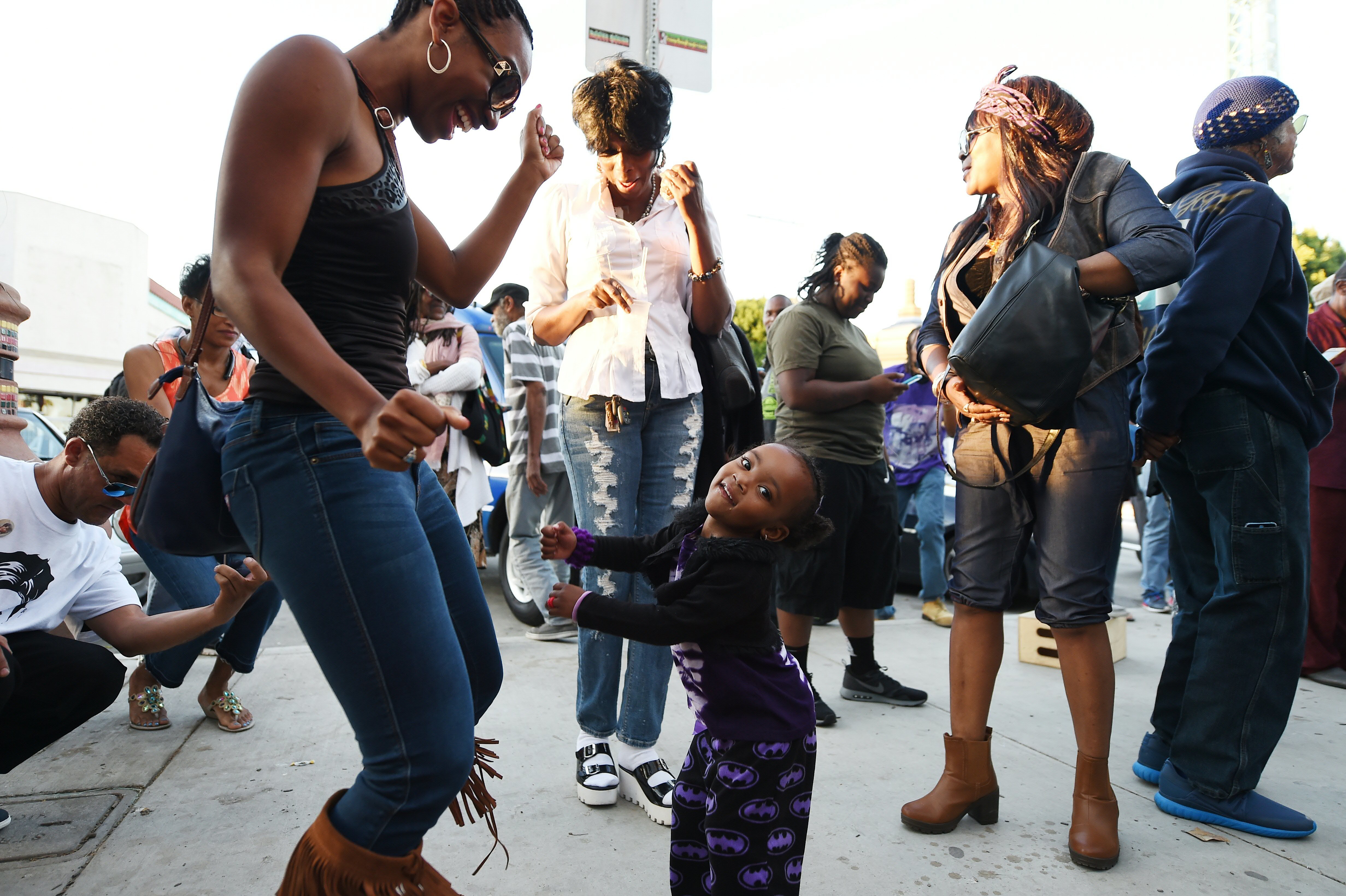 In The Wake Of Prince's Death 2 People dance to Prince's music at Leimert Park in Los Angeles where fans gathered to celebrate and remember the pop music icon's life on April 21, 2016.
