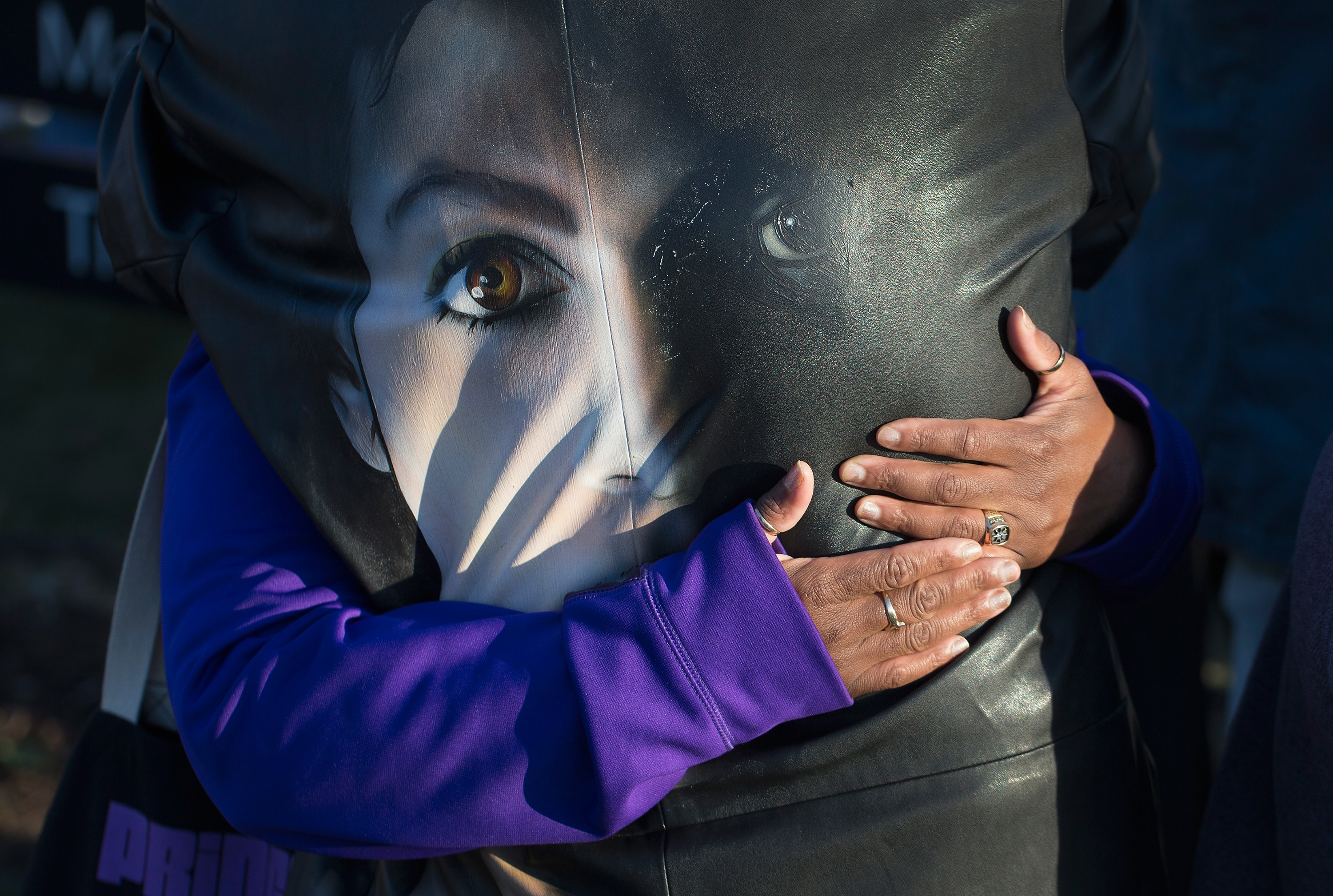 In The Wake Of Prince's Death 4 Fans comfort each other while visiting a memorial outside Paisley Park, the home and studio of Prince, on April 22, 2016.