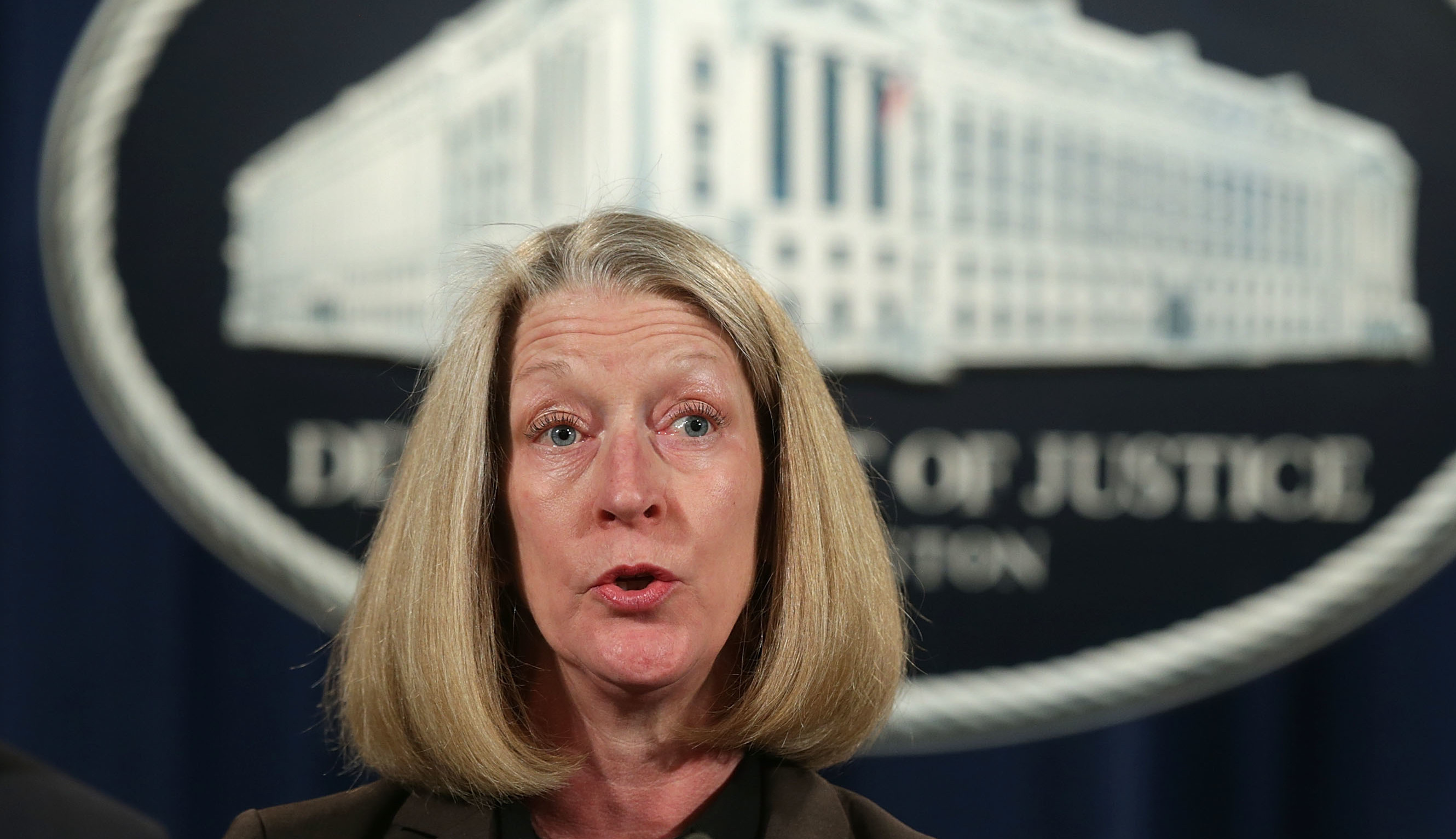 Acting Assistant Attorney General Mary McCord speaks during a news conference at the Justice Department on March 15. McCord told staff members she will be leaving next month. (Getty Images)