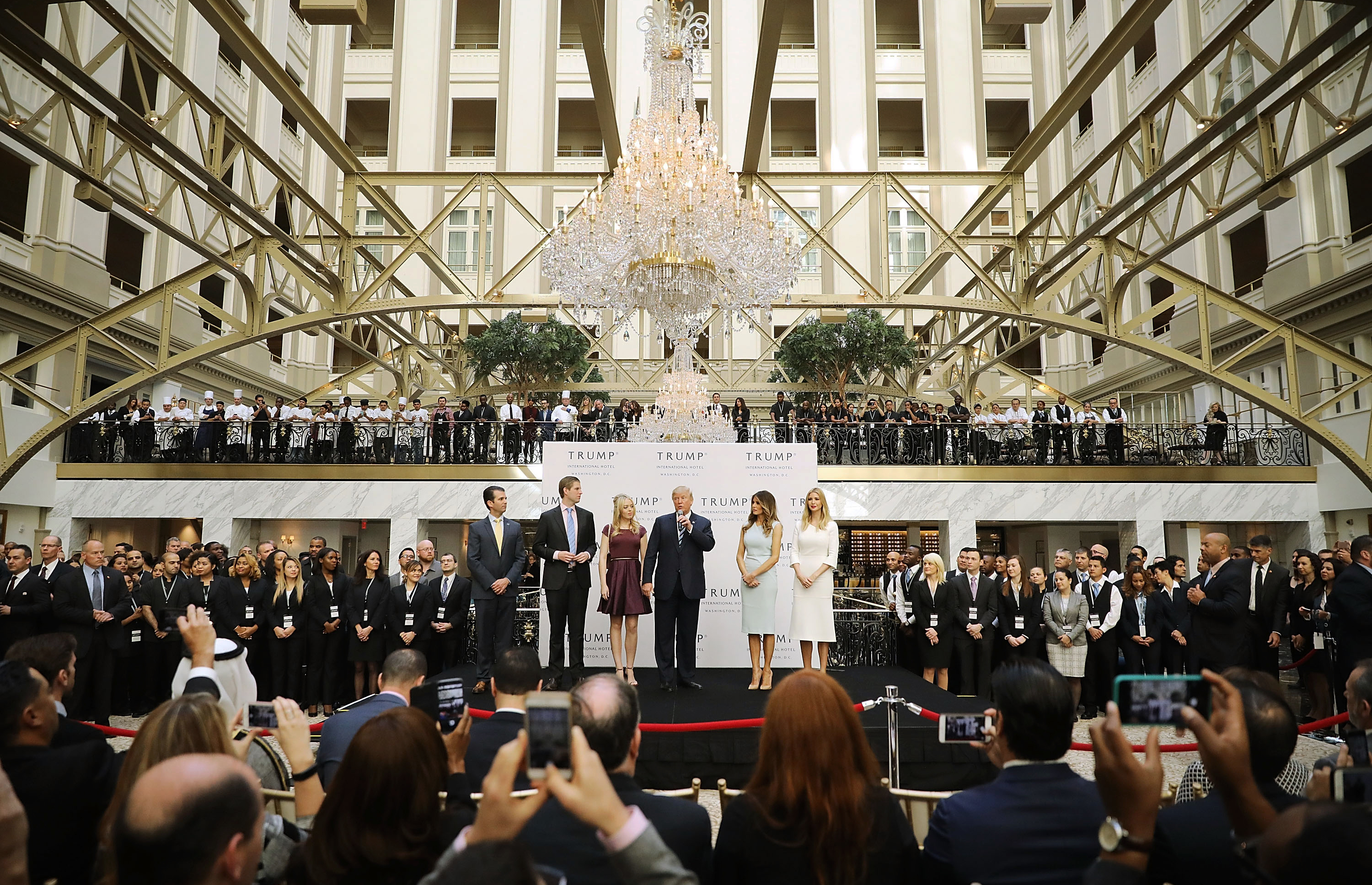 Then Republican presidential candidate Donald Trump (center) and his family prepare to cut the ribbon at the new Trump International Hotel on Oct. 26, 2016, in Washington, D.C. (Getty Images)