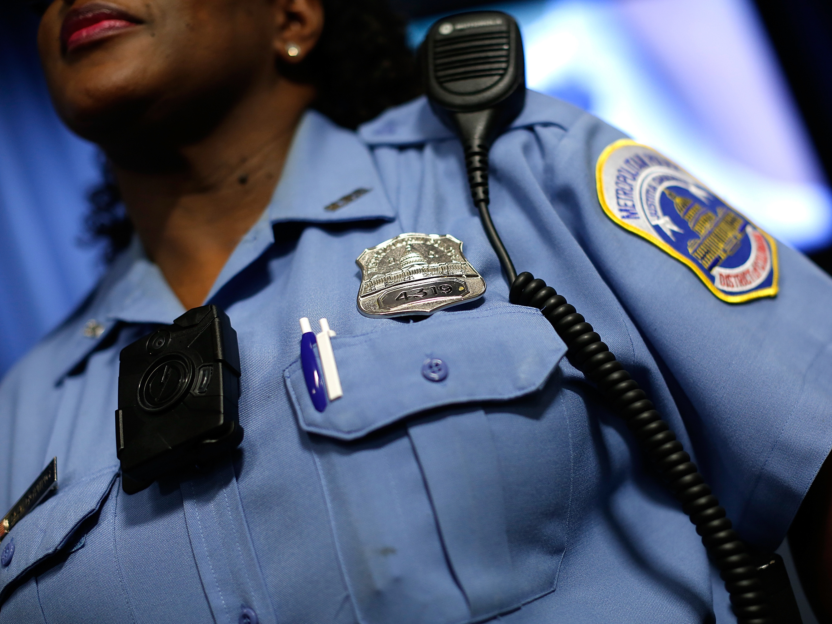 A Washington, D.C., Metropolitan Police officer wears a camera during a news conference in 2014. (Getty Images)