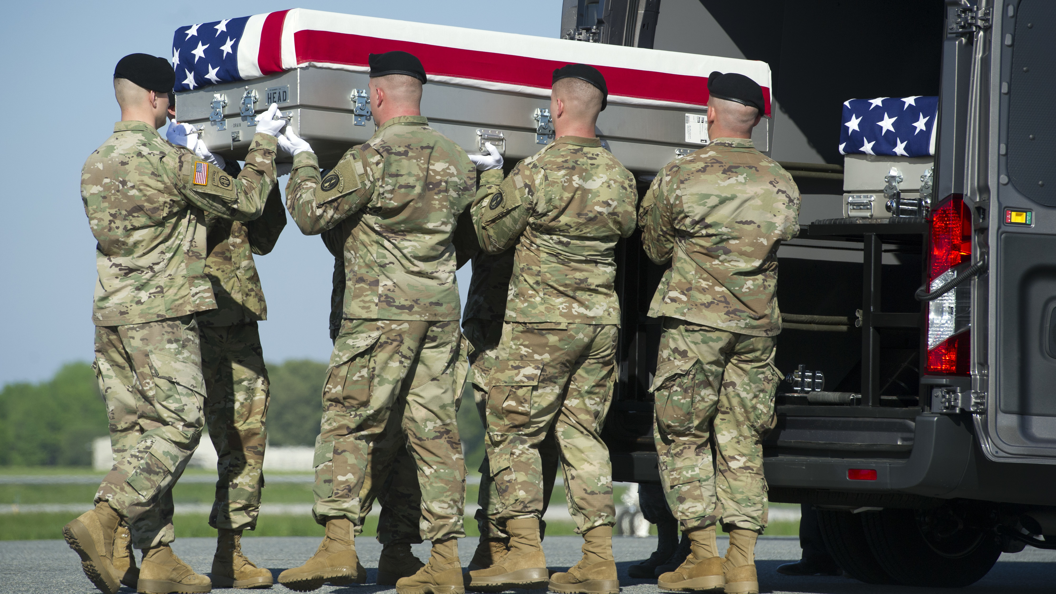 Soldiers transfer the remains of Army Sgt. Joshua Rodgers, 22, of Bloomington, Ill., at Dover Air Force Base, Del. Rodgers and Sgt. Cameron H. Thomas, 23, of Kettering, Ohio, were killed during a raid in Afghanistan.