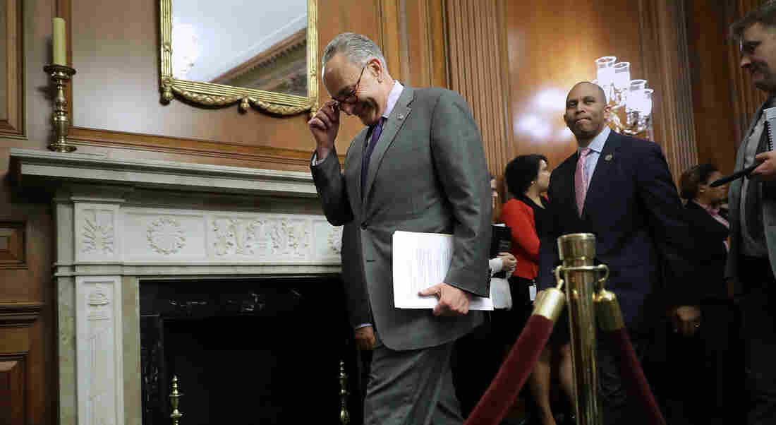 Senate Minority Leader Charles Schumer, D-N.Y., arrives for a news conference about President Trump's 100 Days at the U.S. Capitol on Friday. The Senate passed a short-term spending bill on Friday to avert a government shutdown that would have coincided with the marker.