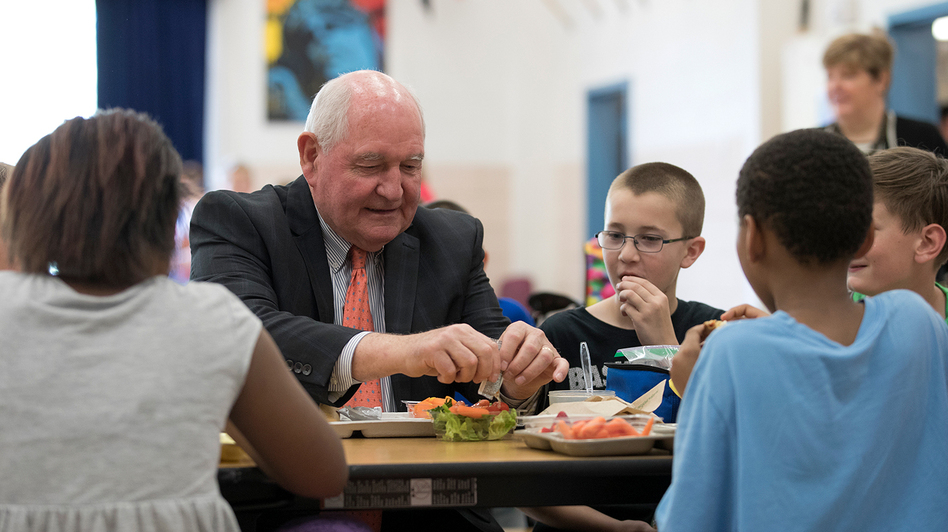 Agriculture Secretary Sonny Perdue eats lunch with students at the Catoctin Elementary School in Leesburg, Va., on Monday. (Carolyn Kaster/AP)