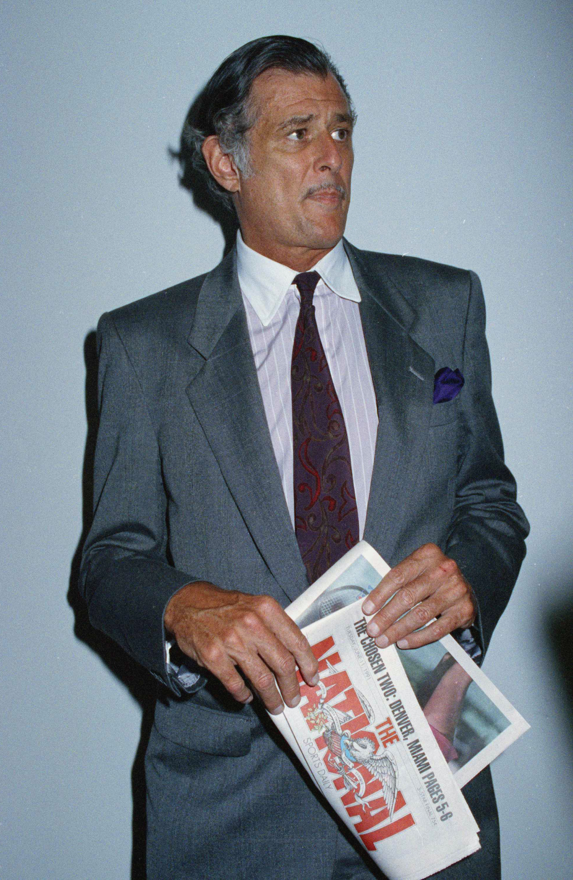 Frank Deford on June 12, 1991, holding a prototype of the final edition of The National, a sports daily where he served as editor in chief from 1989-1991.