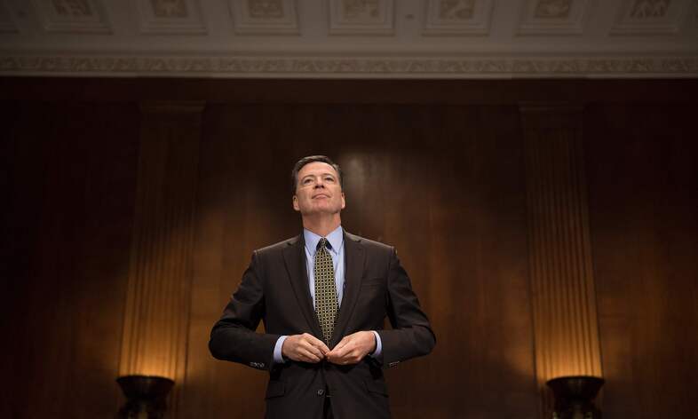 FBI Director James Comey prepares to testify before the Senate Judiciary Committee on Capitol Hill on Wednesday. (Jim Watson/AFP/Getty Images)