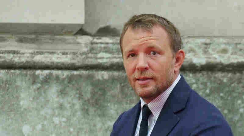 Director Guy Ritchie poses for photographers at Somerset House in central London, on Aug. 7, 2015.