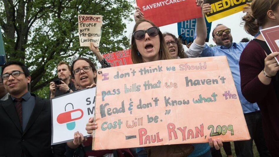 Protesters shout at lawmakers walking out of the Capitol on Thursday after the House of Representatives narrowly passed a Republican effort to repeal and replace the Affordable Care Act. (Nicholas Kamm/AFP via Getty Images)