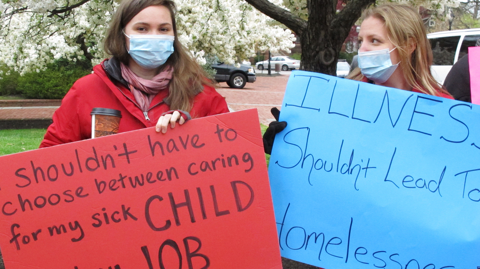 Sandy Robson (left) and Crystal Hall rally for legislation for paid sick leave on April 11, 2016, in Annapolis, Md. Under a bill recently sent to Gov. Larry Hogan, businesses with 15 or more full-time employees would be required to allow workers to earn at least five paid sick days a year. (Brian Witte/AP)