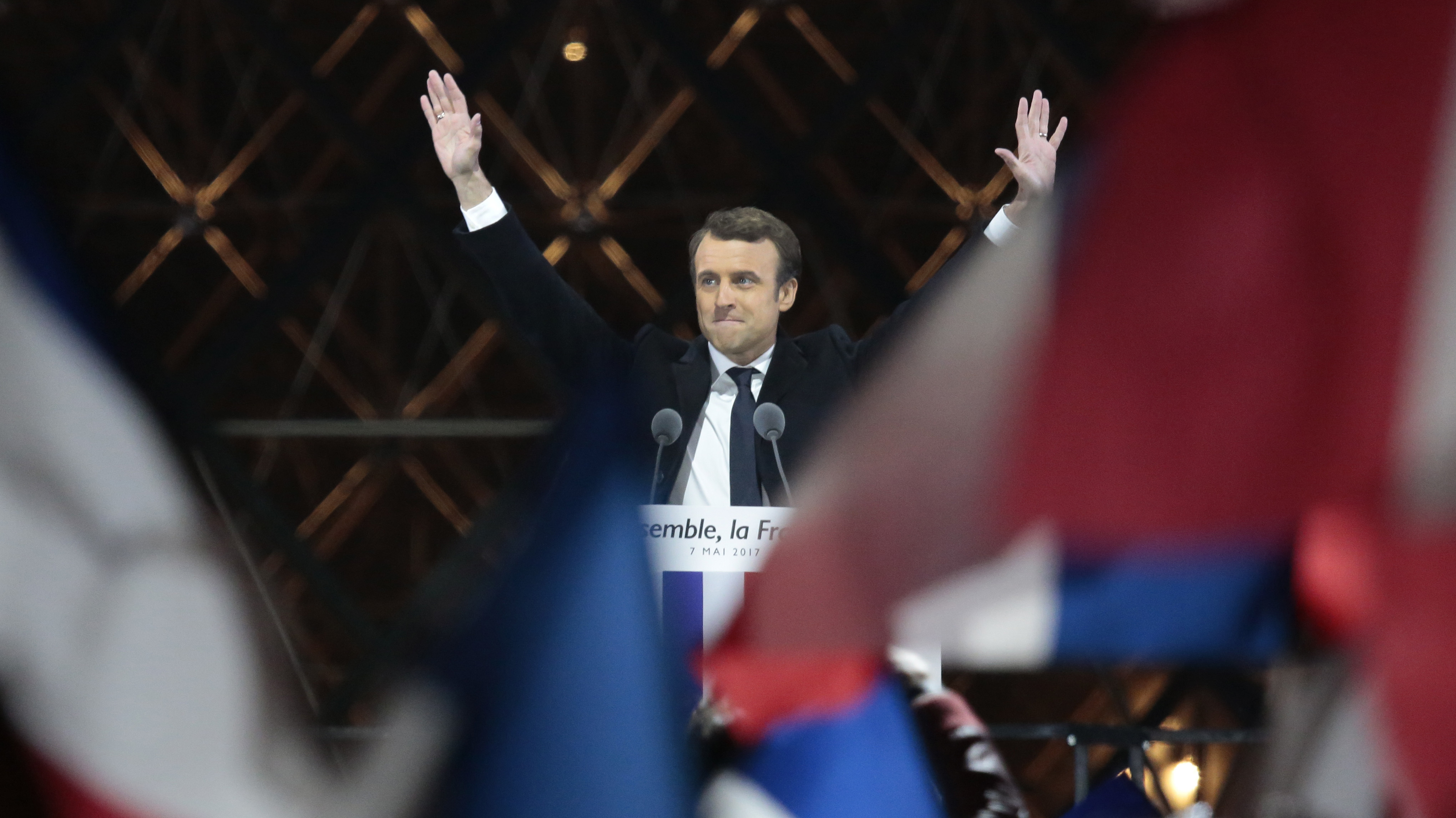 Emmanuel Macron acknowledges supporters at the Louvre on Sunday after winning the French presidential election. Pro-EU centrist Macron defeated far-right rival Marine Le Pen by a comfortable margin. (Getty Images)