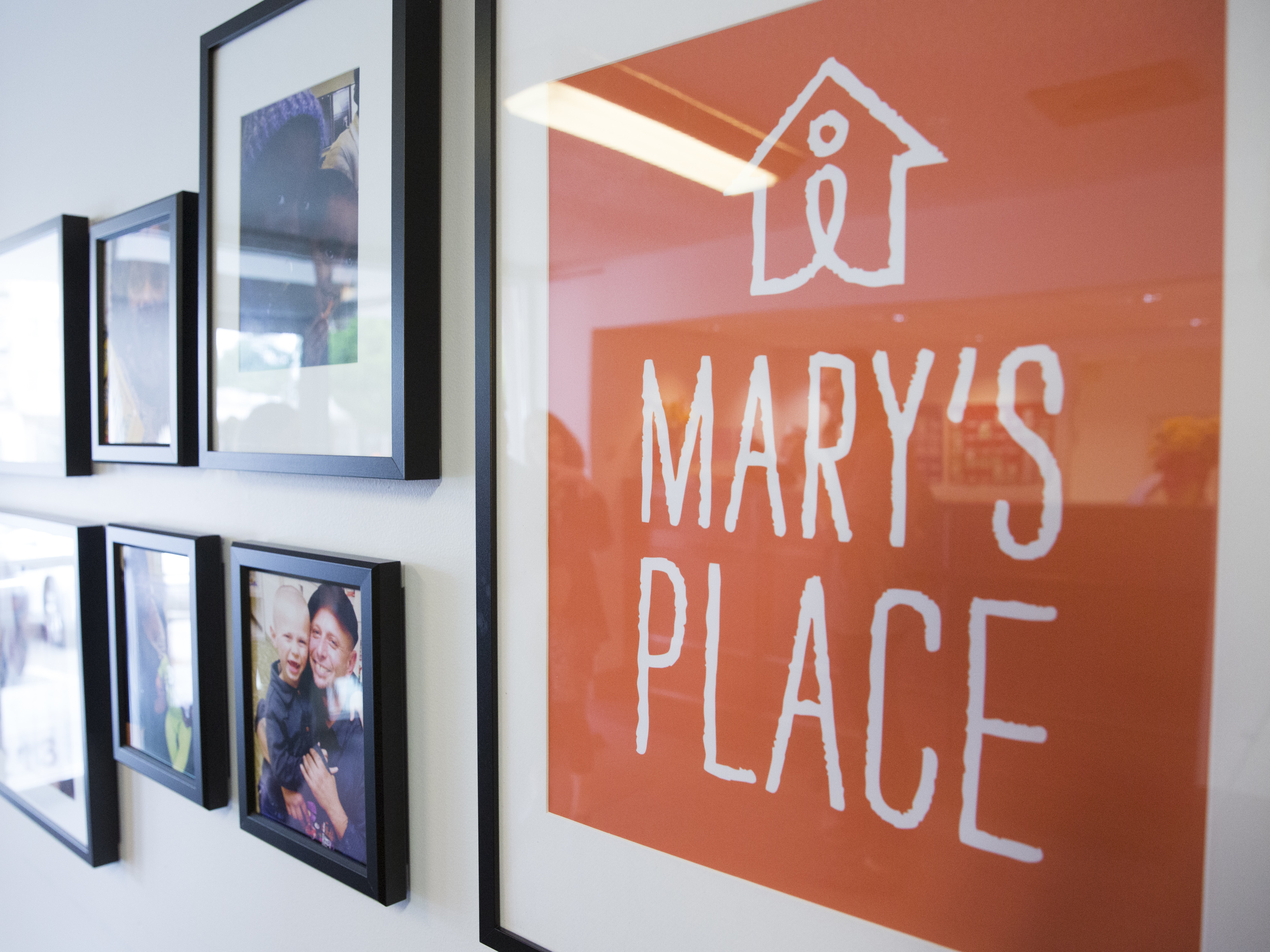 A Seattle motel converted into a homeless shelter is being torn down, but the shelter will find a permanent home in a new six-story Amazon office building. Above, a sign for the Mary's Place shelter adorns a wall in the former motel in May 2016. (AFP/Getty Images)