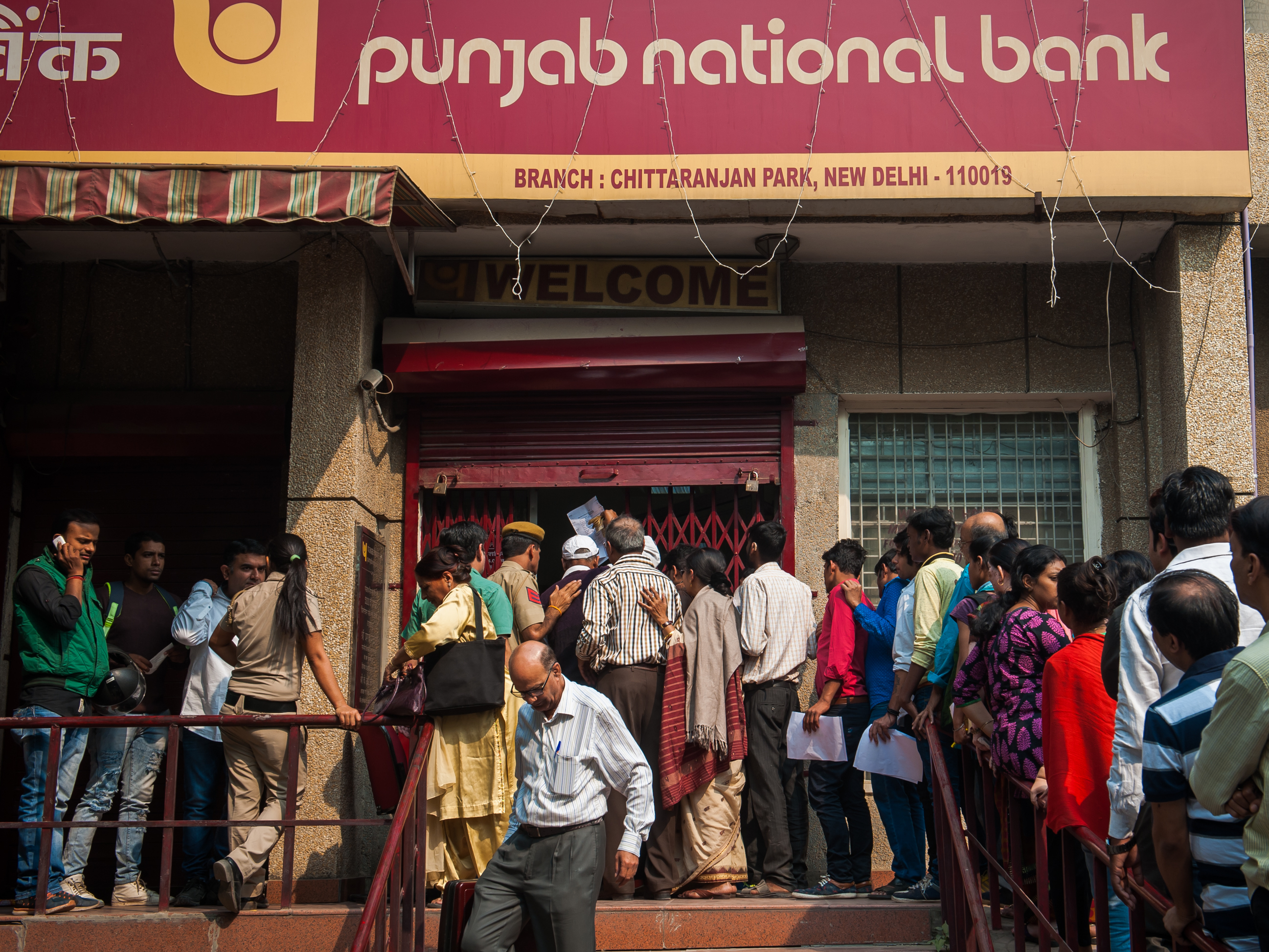 People line up outside a bank to exchange old currency notes with new ones on November 10, 2016 in New Delhi India. (Barcroft Media via Getty Images)