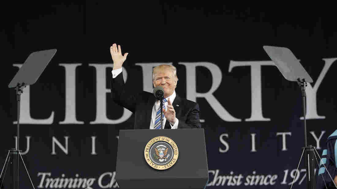 Trump slams 'critics' in his first commencement address as president
